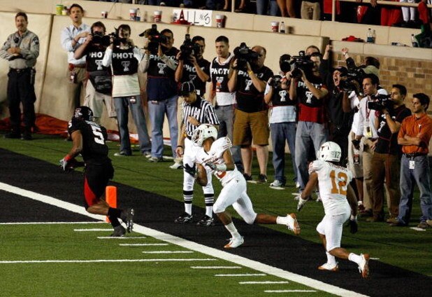LUBBOCK, TX - NOVEMBER 01:  Michael Crabtree #5 of the Texas Tech Red Raiders carries the ball into the end zone to score the winning touchdown during the game against the Texas Longhorns on November 1, 2008 at Jones Stadium in Lubbock, Texas.  (Photo by 