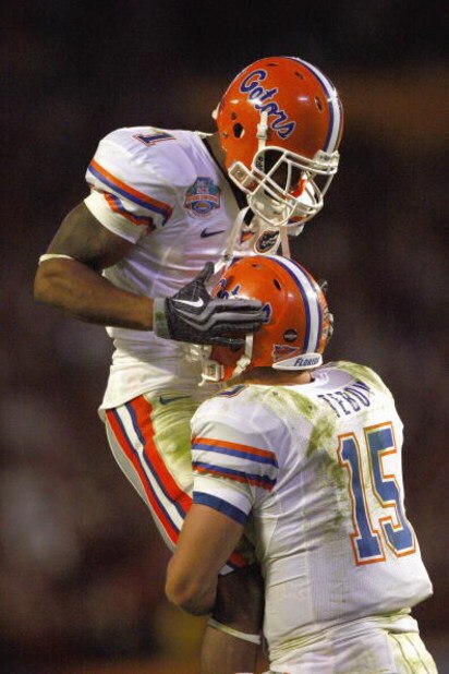 MIAMI - JANUARY 08:  Percy Harvin #1 of the Florida Gators celebrates with quarterback Tim Tebow #15 during the FedEx BCS National Championship Game against the Oklahoma Sooners at Dolphin Stadium on January 8, 2009 in Miami, Florida.  (Photo by Donald Mi