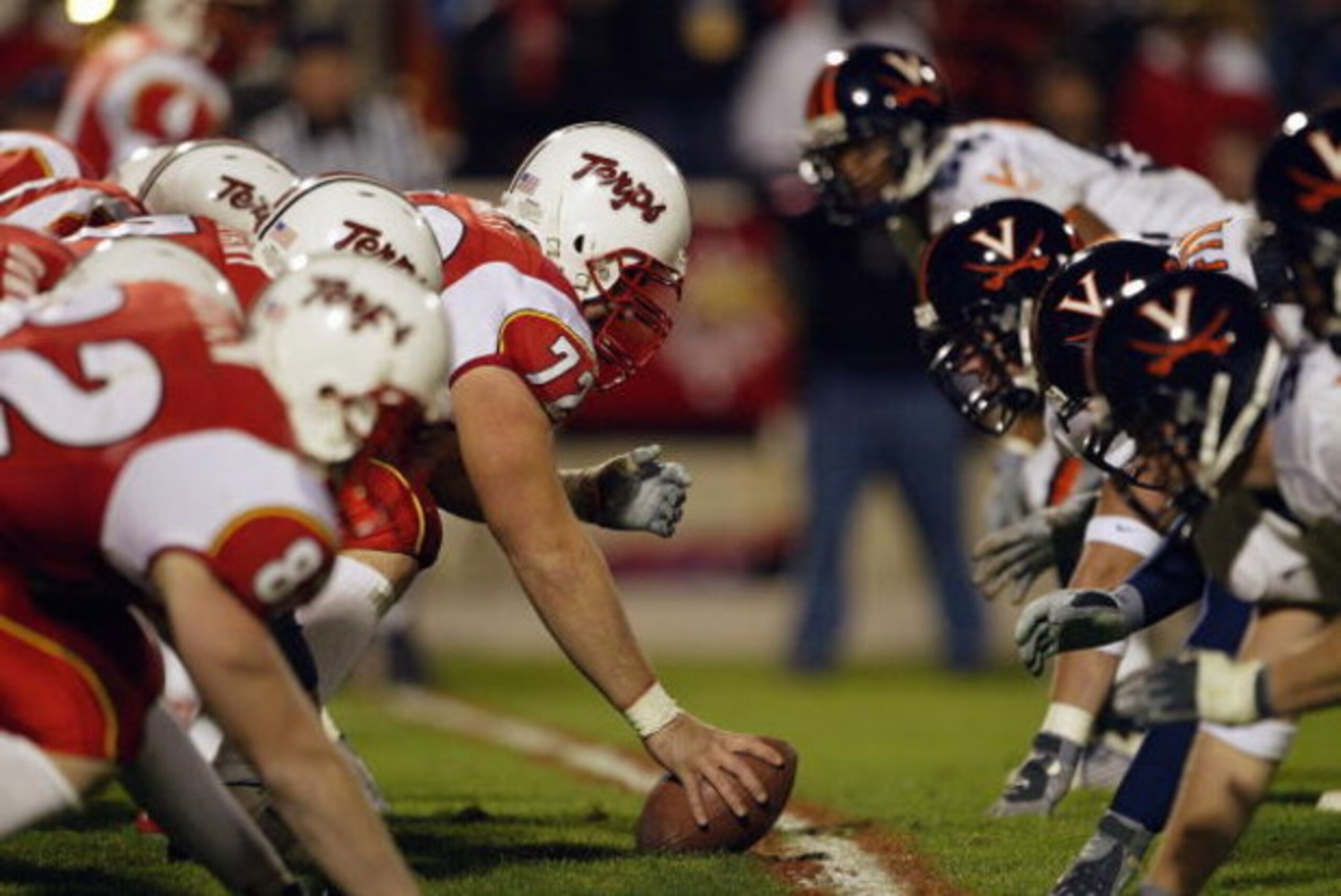 COLLEGE PARK, MD - NOVEMBER 13:  Center Kyle Schmitt #72 of the Maryland Terrapins gets ready to hike the football during the game against the Virginia Cavaliers on November 13, 2003 at Byrd Stadium in College Park, Maryland. The Terps defeated the Cavs 2