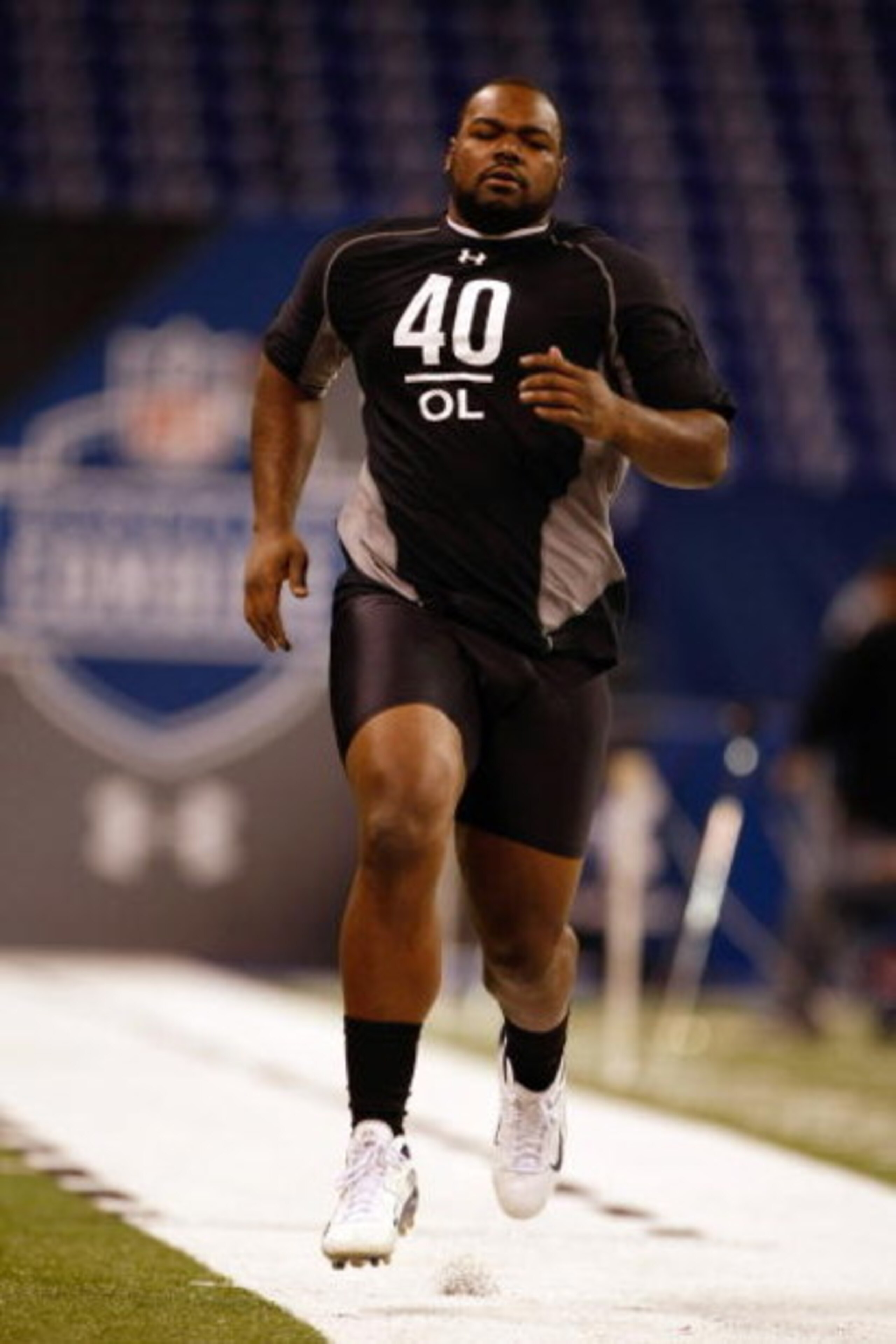INDIANAPOLIS, IN - FEBRUARY 21:  Offensive lineman Michael Oher of Mississippi runs the 40 yard dash as he participates in drills during the NFL Scouting Combine presented by Under Armour at Lucas Oil Stadium on February 21, 2009 in Indianapolis, Indiana.