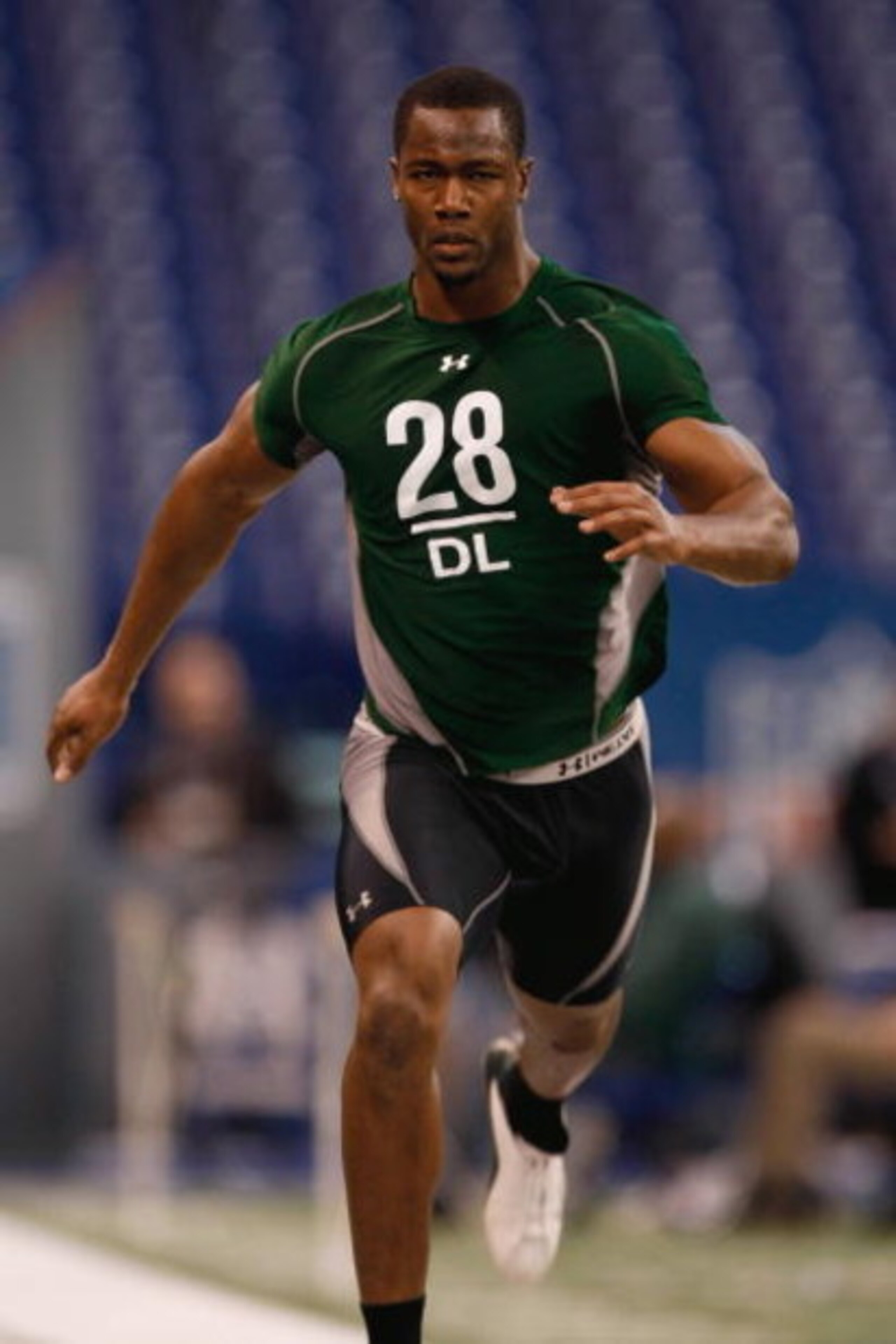 INDIANAPOLIS, IN - FEBRUARY 23:  Defensive lineman Mike Johnson of Georgia Tech runs the 40 yard dash during the NFL Scouting Combine presented by Under Armour at Lucas Oil Stadium on February 23, 2009 in Indianapolis, Indiana. (Photo by Scott Boehm/Getty