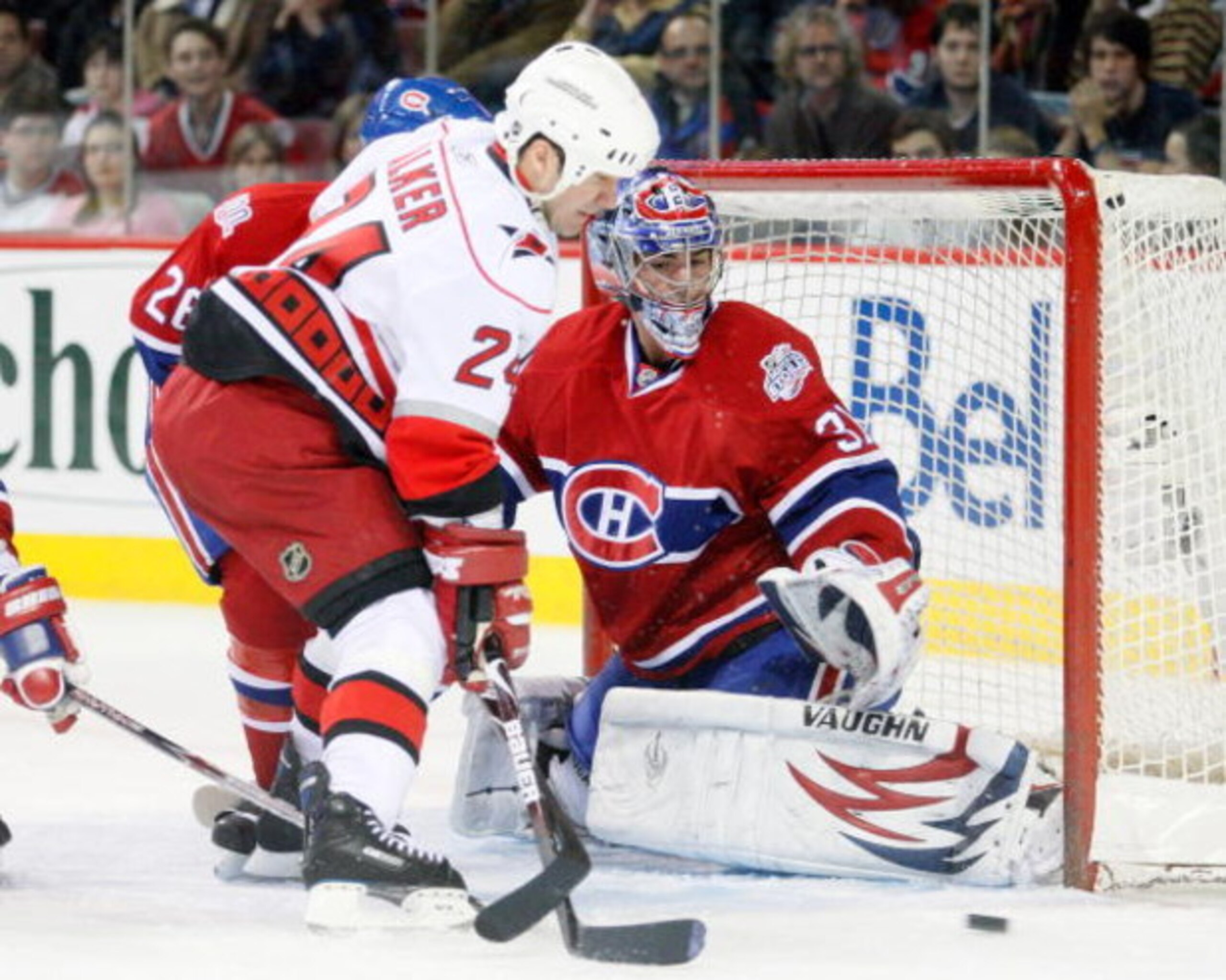 MONTREAL- DECEMBER 21:  Scott Walker #24 of the Carolina Hurricanes looks for the loose puck in front of Carey Price #31 of the Montreal Canadiens during the game at the Bell Centre on December 21, 2008 in Montreal, Quebec, Canada.  (Photo by Richard Wolo