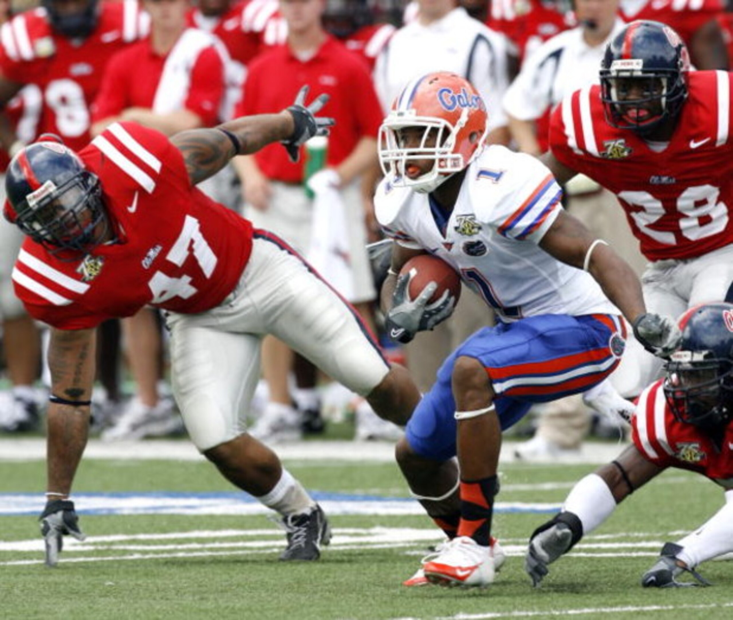 OXFORD, MS - SEPTEMBER 22:  Percy Harvin #1 of the Florida Gators runs against Tony Fein #47 of the Mississippi Rebels on September 22, 2007 at Vaught-Hemingway Stadium/Hollingsworth Field in Oxford, Mississippi. (Photo by Joe Murphy/Getty Images)