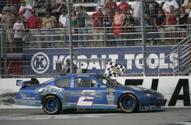 HAMPTON, GA - MARCH 08:  Kurt Busch driver of the #2 Miller Lite Dodge celebrates winning the NASCAR Sprint Cup Series Kobalt Tools 500 at the Atlanta Motor Speedway on March 8, 2009 in Hampton, Georgia.  (Photo by Jerry Markland/Getty Images for NASCAR)