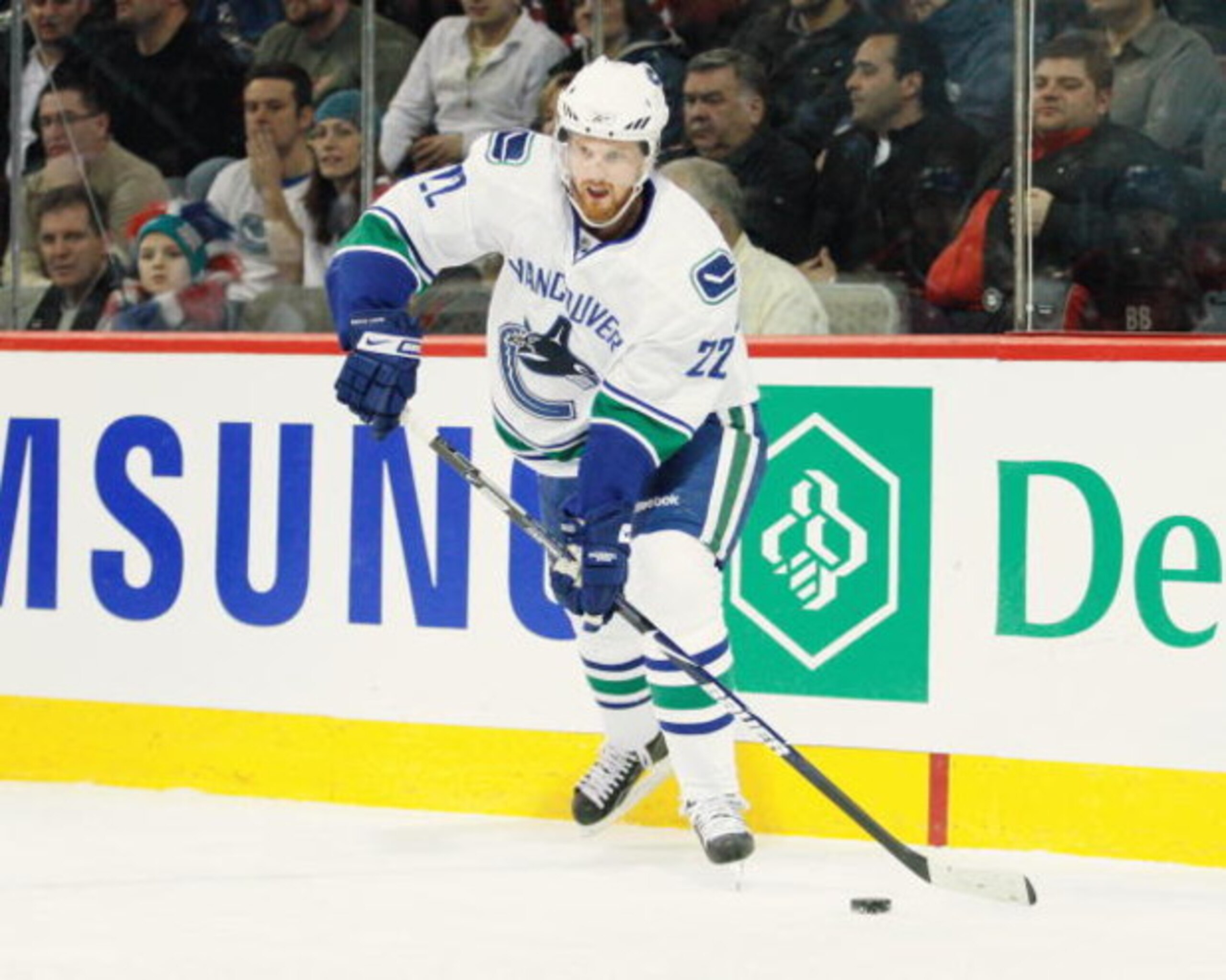 MONTREAL- FEBRUARY 24:  Daniel Sedin #22 of the Vancouver Canucks passes the puck during the game against the Montreal Canadiens at the Bell Centre on February 24, 2009 in Montreal, Quebec, Canada.  The Canadiens defeated the Canucks 3-0.  (Photo by Richa