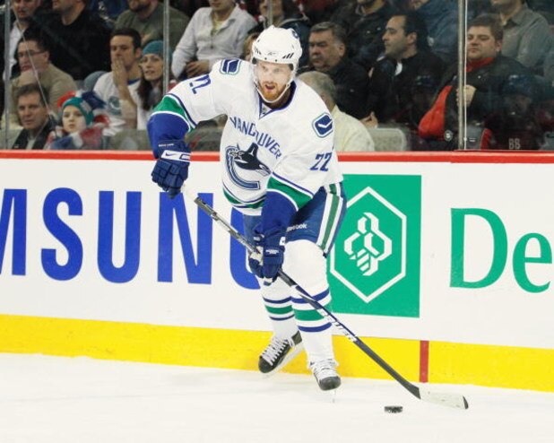 MONTREAL- FEBRUARY 24:  Daniel Sedin #22 of the Vancouver Canucks passes the puck during the game against the Montreal Canadiens at the Bell Centre on February 24, 2009 in Montreal, Quebec, Canada.  The Canadiens defeated the Canucks 3-0.  (Photo by Richa