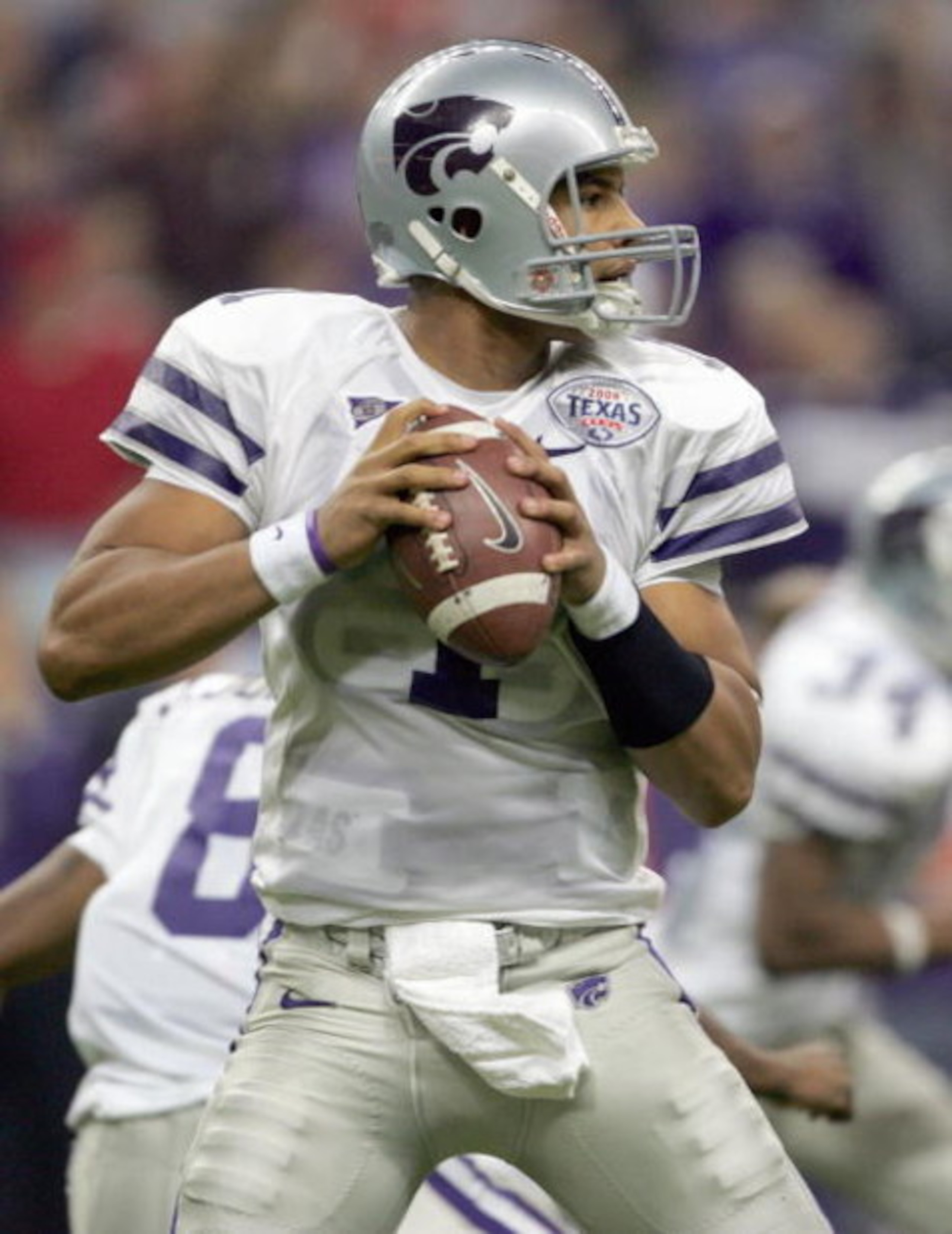 HOUSTON - DECEMBER 28: Josh Freeman #1 of the Kansas State Wildcats looks to pass during the Texas Bowl against the Rutgers Scarlet Knights on December 28, 2006 at Reliant Stadium in Houston Texas. (Photo by Stephen Dunn/Getty Images)