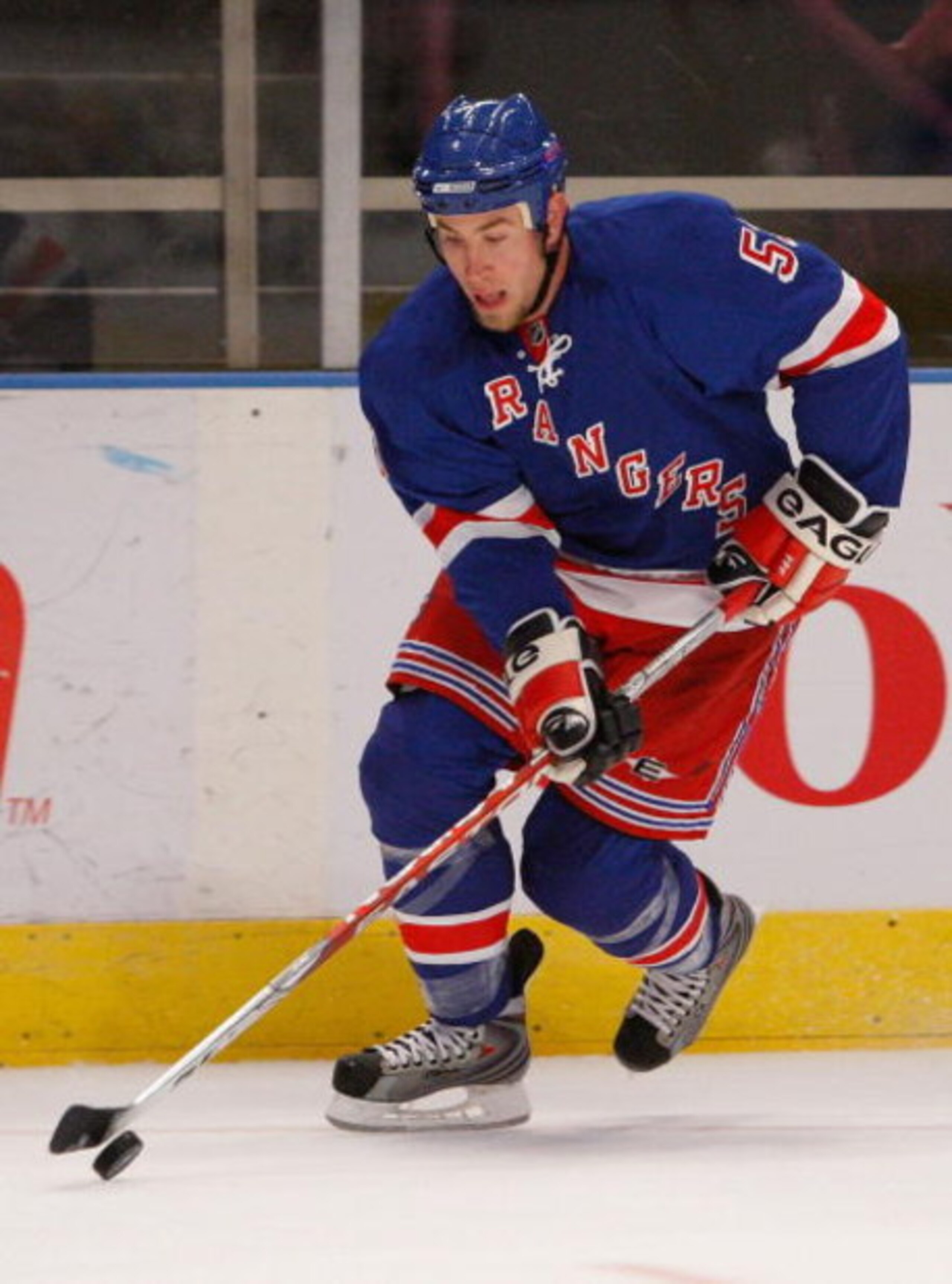 NEW YORK - MARCH 08:  Derek Morris #53 of the New York Rangers skates with the puck against the Boston Bruins on March 8, 2009 at Madison Square Garden in New York City, New York.  (Photo by Nick Laham/Getty Images)