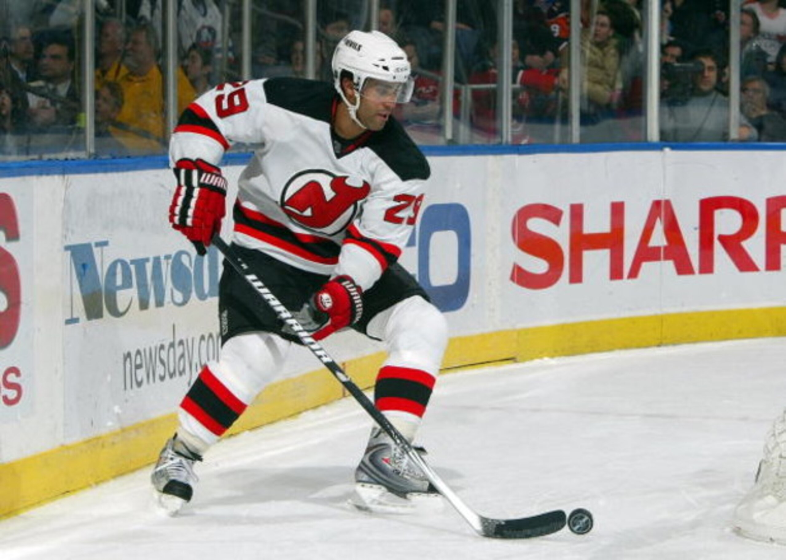 UNIONDALE, NY - FEBRUARY 21:  Johnny Oduya #29 of the New Jersey Devils skates against the New York Islanders on February 21, 2009 at Nassau Coliseum in Uniondale, New York. The Isles shutout the Devils 4-0.  (Photo by Jim McIsaac/Getty Images)