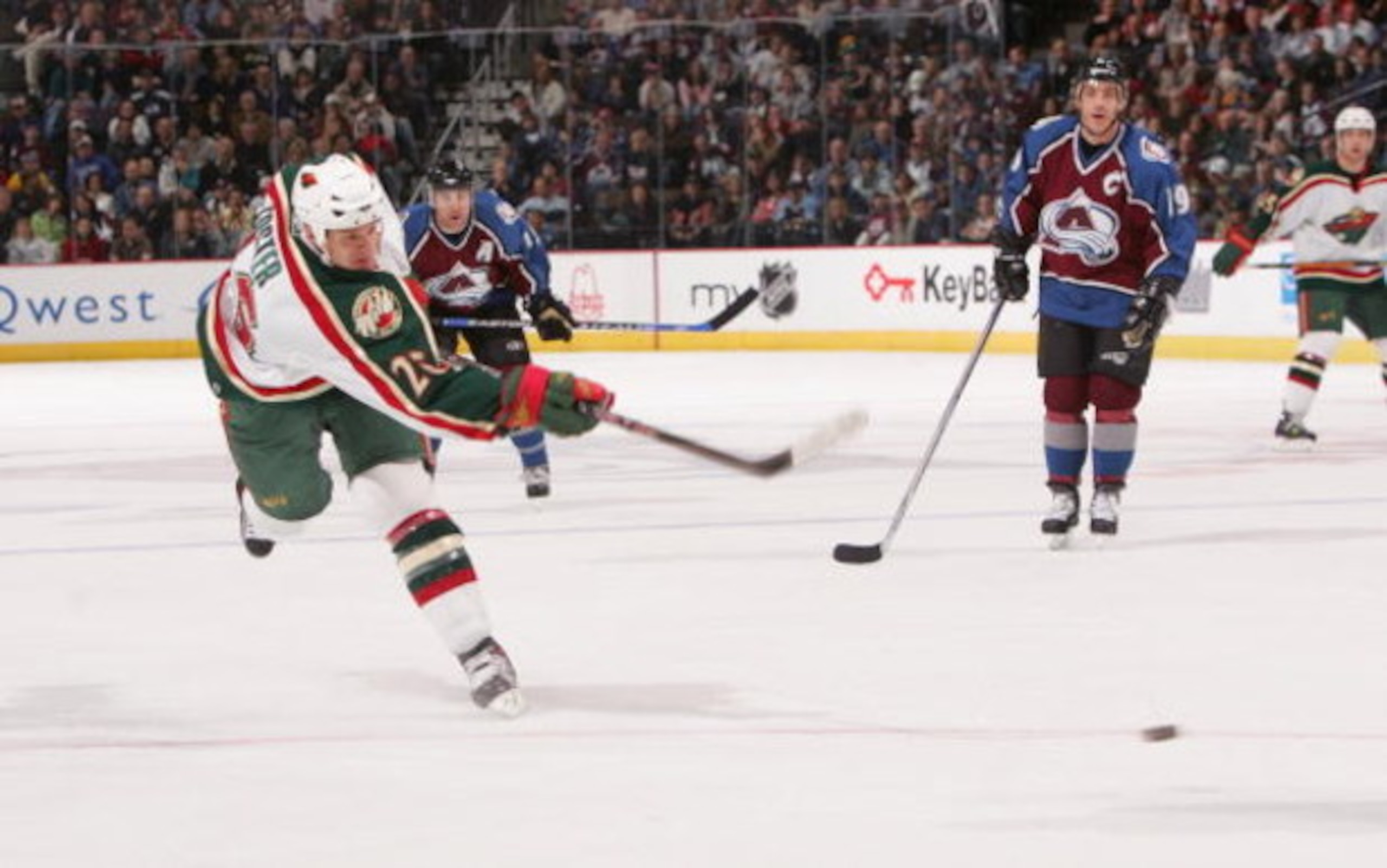 DENVER - MARCH 31:  Kurtis Foster #26 of the Minnesota Wild shoots the puck against the Colorado Avalanche at the Pepsi Center on March 31,2007 in Denver, Colorado. The Avalanche won 2-1. (Photo by Doug Pensinger/Getty Images)