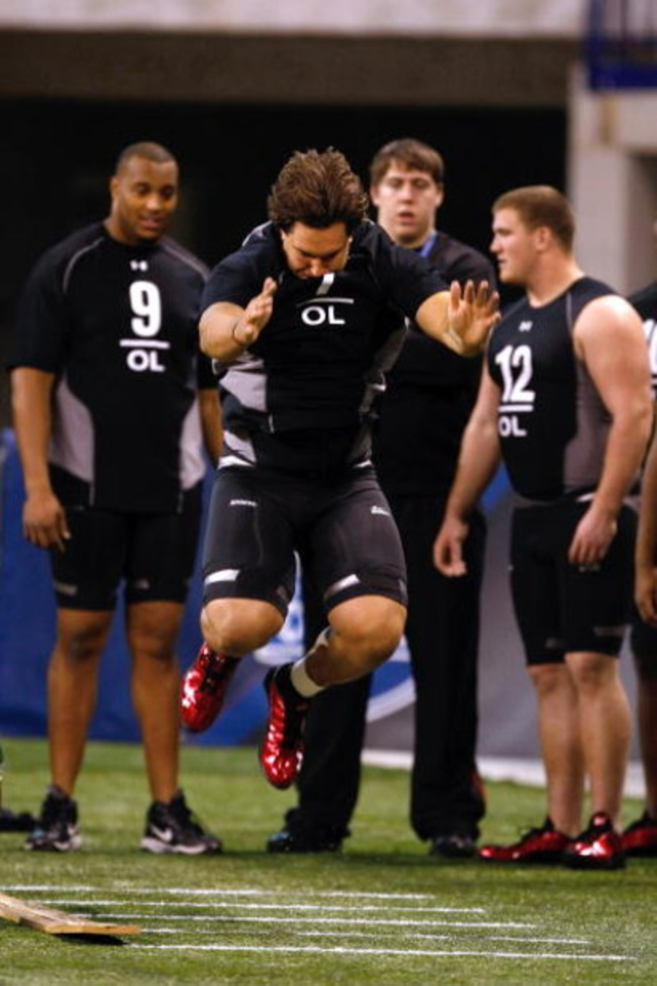 INDIANAPOLIS, IN - FEBRUARY 21:  Offensive lineman Eben Britton of Arizona jumps in the broad jump as he participates in practice drills during the NFL Scouting Combine presented by Under Armour at Lucas Oil Stadium on February 21, 2009 in Indianapolis, I