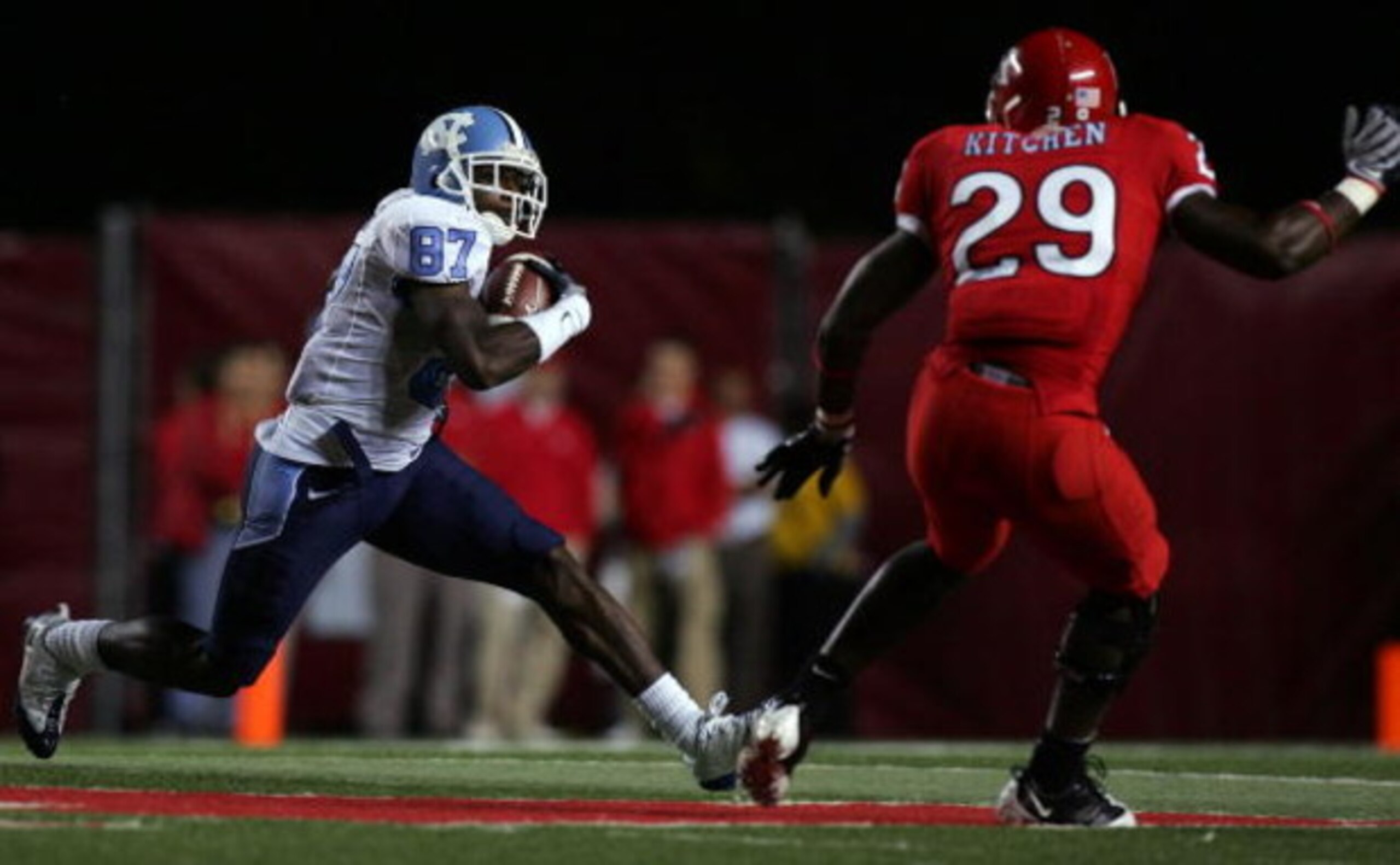PISCATAWAY, NJ - SEPTEMBER 11:  Brandon Tate #87 of the North Carolina Tar Heels runs the ball against Zaire Kitchen #29 of the Rutgers Scarlet Knights at Rutgers Stadium on September 11, 2008 in Piscataway, New Jersey. North Carolina defeated Rutgers 44-