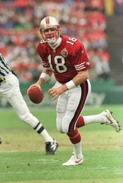 17 Nov 1996:  Quarterback Elvis Grbac of the San Francisco 49ers looks downfield while scrambling with the football during the first quarter versus the Baltimore Ravens at 3Com Park in San Francisco, California.  Mandatory Credit: Otto Greule/Allsport
