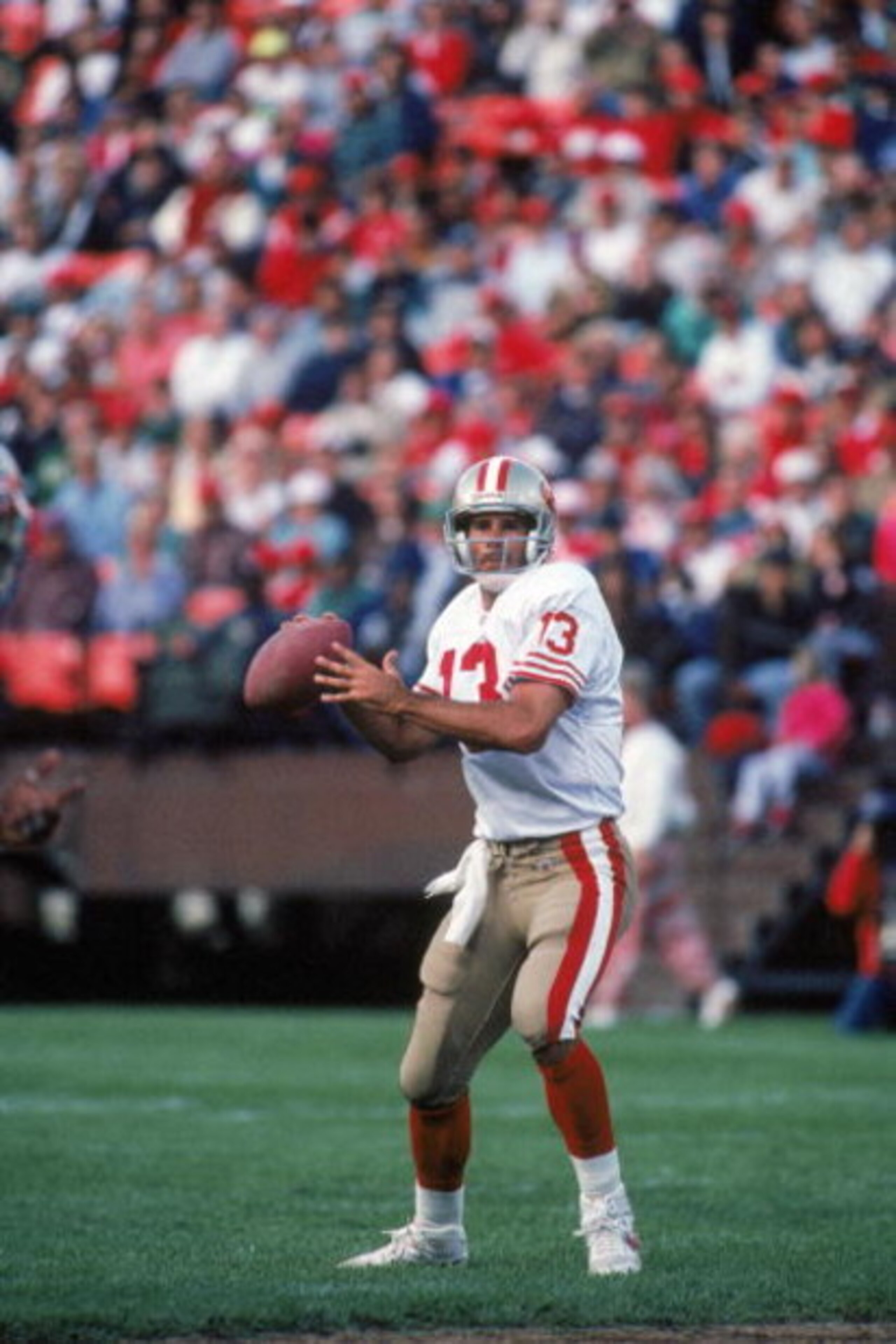 AUGUST 3: Quarterback Steve Bono #13 of the San Francisco 49ers looks to pass against the Denver Broncos during a preseason game on August 3, 1992. The 49ers won 13-7. (Photo by George Rose/Getty Images) AUGUST 3: Quarterback Steve Bono #13 of the San Francisco 49ers looks to pass against the Denver Broncos during a preseason game on August 3, 1992. The 49ers won 13-7. (Photo by George Rose/Getty Images)