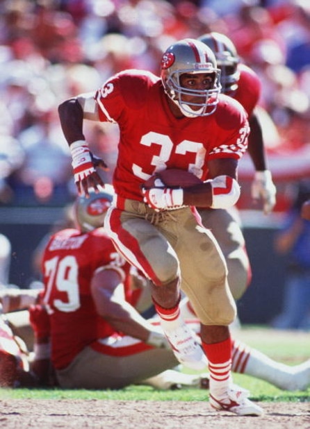 16 SEP 1990:  SAN FRANCISCO RUNNING BACK ROGER CRAIG CARRIES THE FOOTBALL IN THE OPEN FIELD DURING THE 49ERS 26-13 VICTORY OVER THE WASHINGTON REDSKINS AT CANDLESTICK PARK IN SAN FRANCISCO, CALIFORNIA. Mandatory Credit: Mike Powell/ALLSPORT