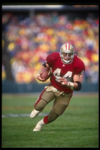 17 Jan 1993:  Running back Tom Rathman of the San Francisco 49ers runs with the ball during a playoff game against the Dallas Cowboys at Candlestick Park in San Francisco, California.  The Cowboys won the game, 30-20. Mandatory Credit: Otto Greule  /Allsp