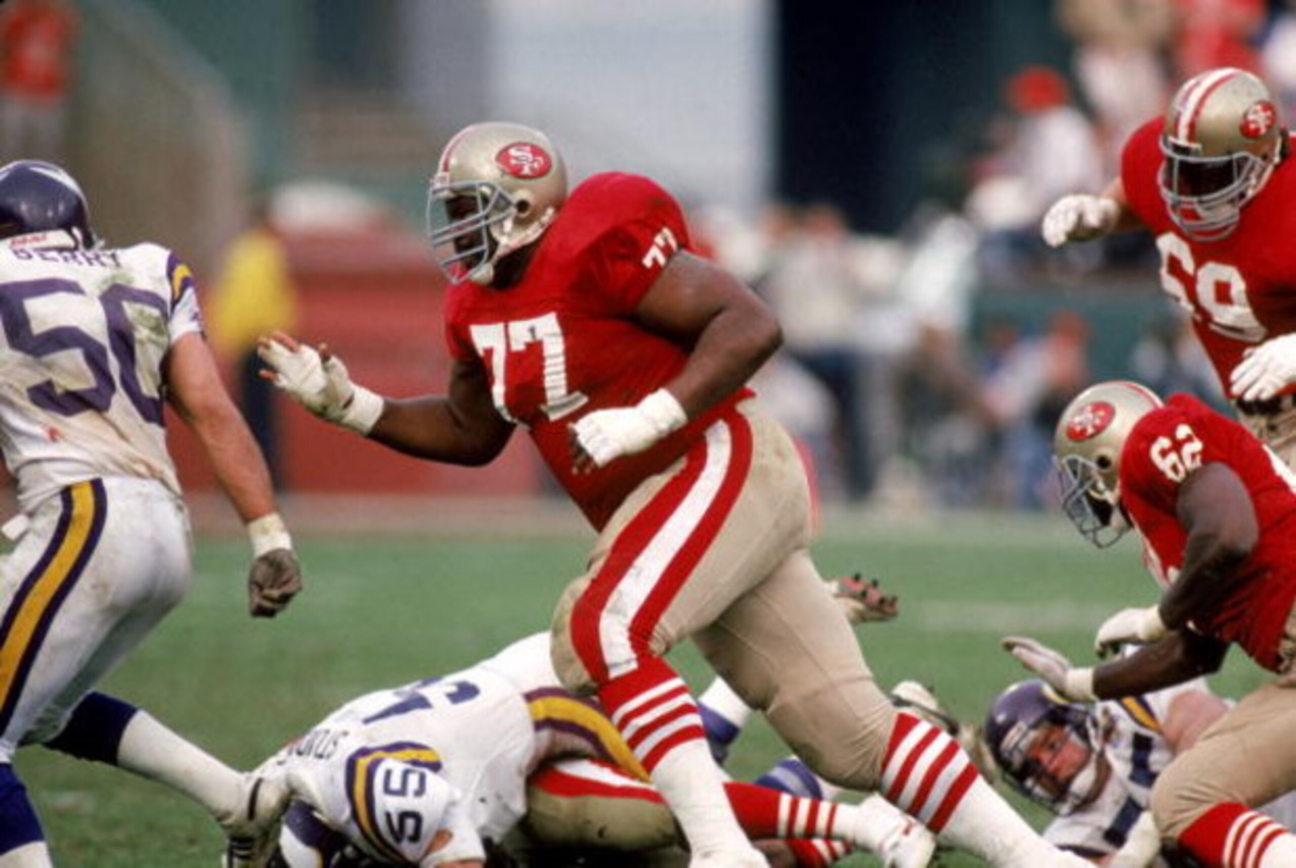 SAN FRANCISCO - JANUARY 6: Tackle Bubba Paris #77 of the San Francisco 49ers blocks during the 1989 NFC Divisional Playoff game against the Minnesota Vikings at Candlestick Park on January 6, 1990 in San Francisco, California. The 49ers won 41-13. (Pho SAN FRANCISCO - JANUARY 6: Tackle Bubba Paris #77 of the San Francisco 49ers blocks during the 1989 NFC Divisional Playoff game against the Minnesota Vikings at Candlestick Park on January 6, 1990 in San Francisco, California. The 49ers won 41-13. (Pho
