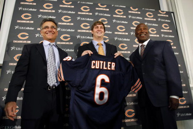 LAKE FOREST, IL - APRIL 3:  Chicago Bears general manager Jerry Angelo, quarterback Jay Cutler and head coach Lovie Smith are all smiles after introducing Cutler as their new quarterback during a press conference on April 3, 2009 at Halas Hall in Lake For