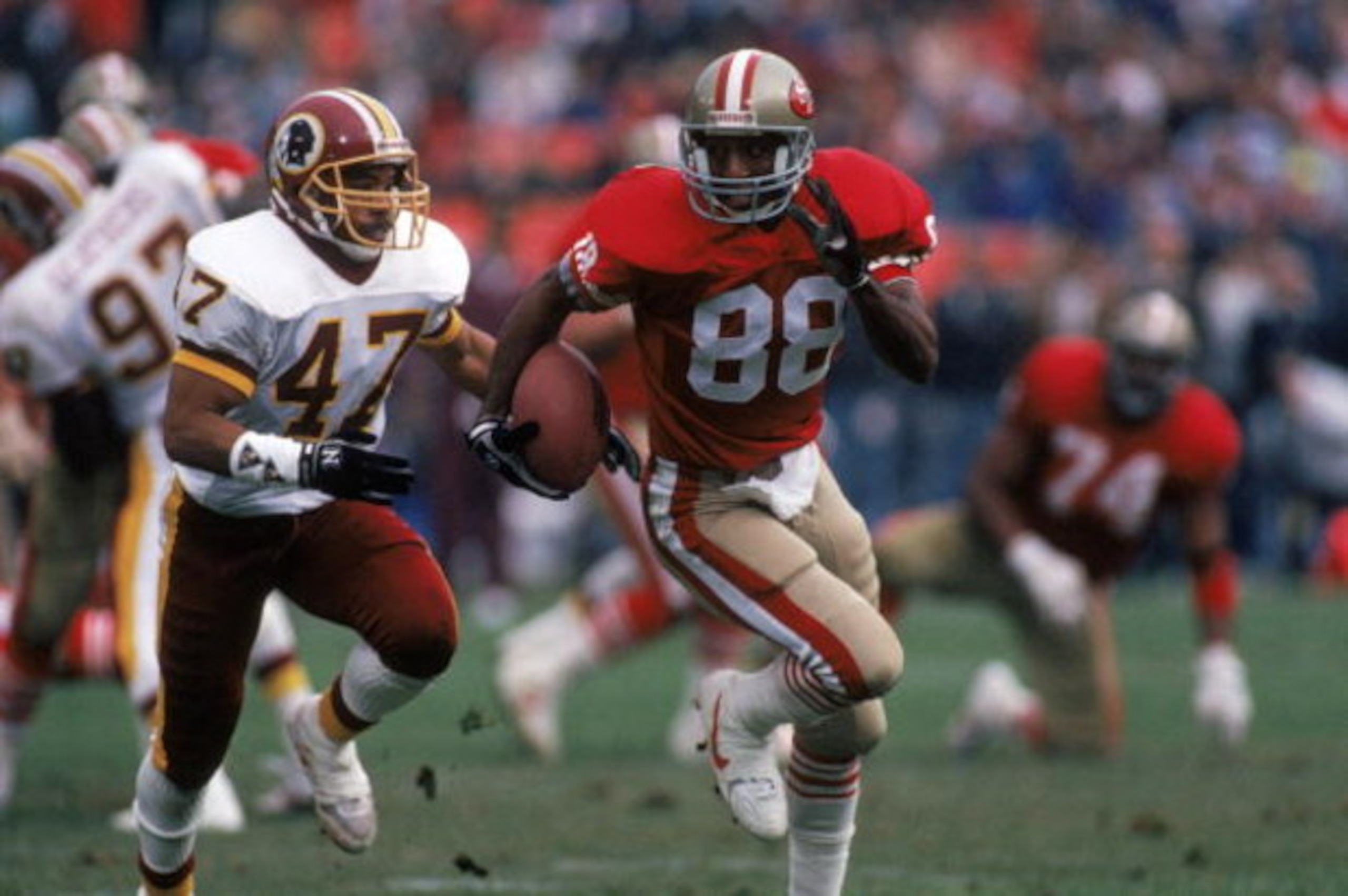 SAN FRANCISCO - JANUARY 12: Wide receivers Mike Sherrard #88 of the San Francisco 49ers runs away from Washington Redskins cornerback A. J. Johnson #47 during the 1990 NFC Divisional Playoff game at Candlestick Park on January 12, 1991 in San Francisco, SAN FRANCISCO - JANUARY 12: Wide receivers Mike Sherrard #88 of the San Francisco 49ers runs away from Washington Redskins cornerback A. J. Johnson #47 during the 1990 NFC Divisional Playoff game at Candlestick Park on January 12, 1991 in San Francisco,