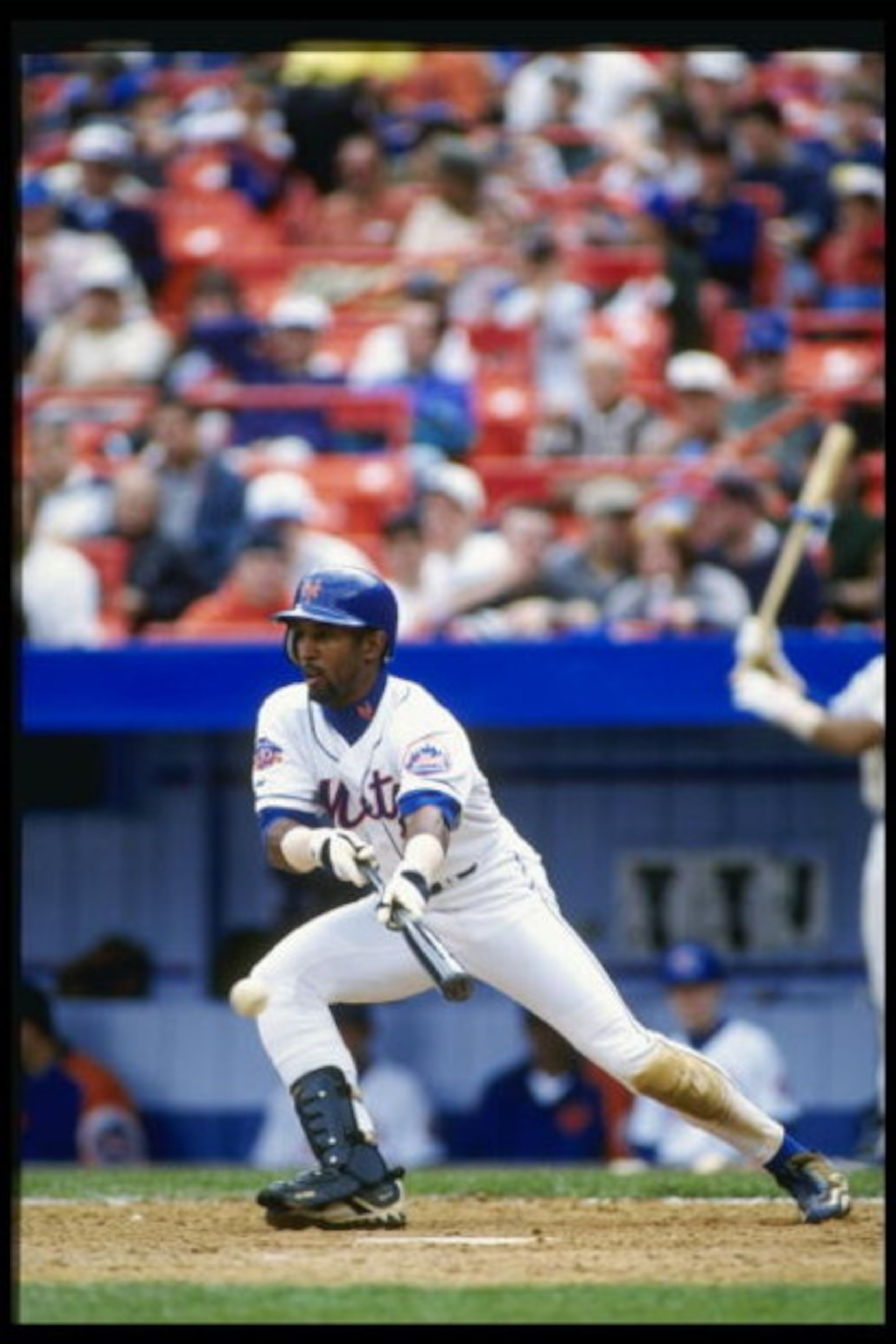 13 Apr 1997: Lance Johnson of the New York Mets bunts the ball during the Mets 5-1 loss to the San Francisco Giants at Shea Stadium in Flushing, New York.