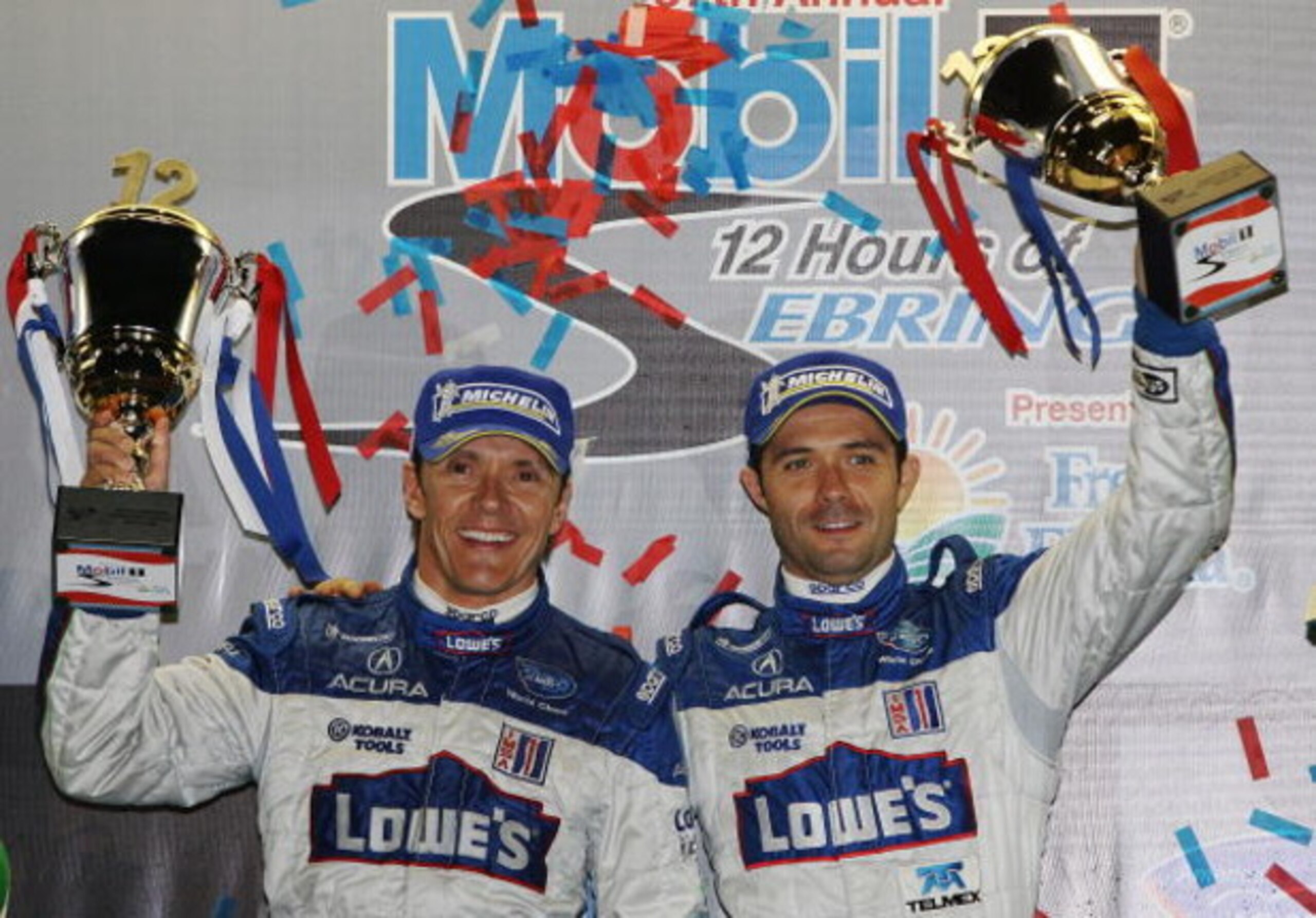 SEBRING, FL - MARCH 21:  Adrian Fernandez (L), and Luis Diaz of the #15 Lowe's Fernandez Racing Acura ARX-01B celebrate their victory in the LMP2 class during the 57th Annual Mobil1 12 Hours of Sebring at Sebring International Raceway on March 21, 2009 in