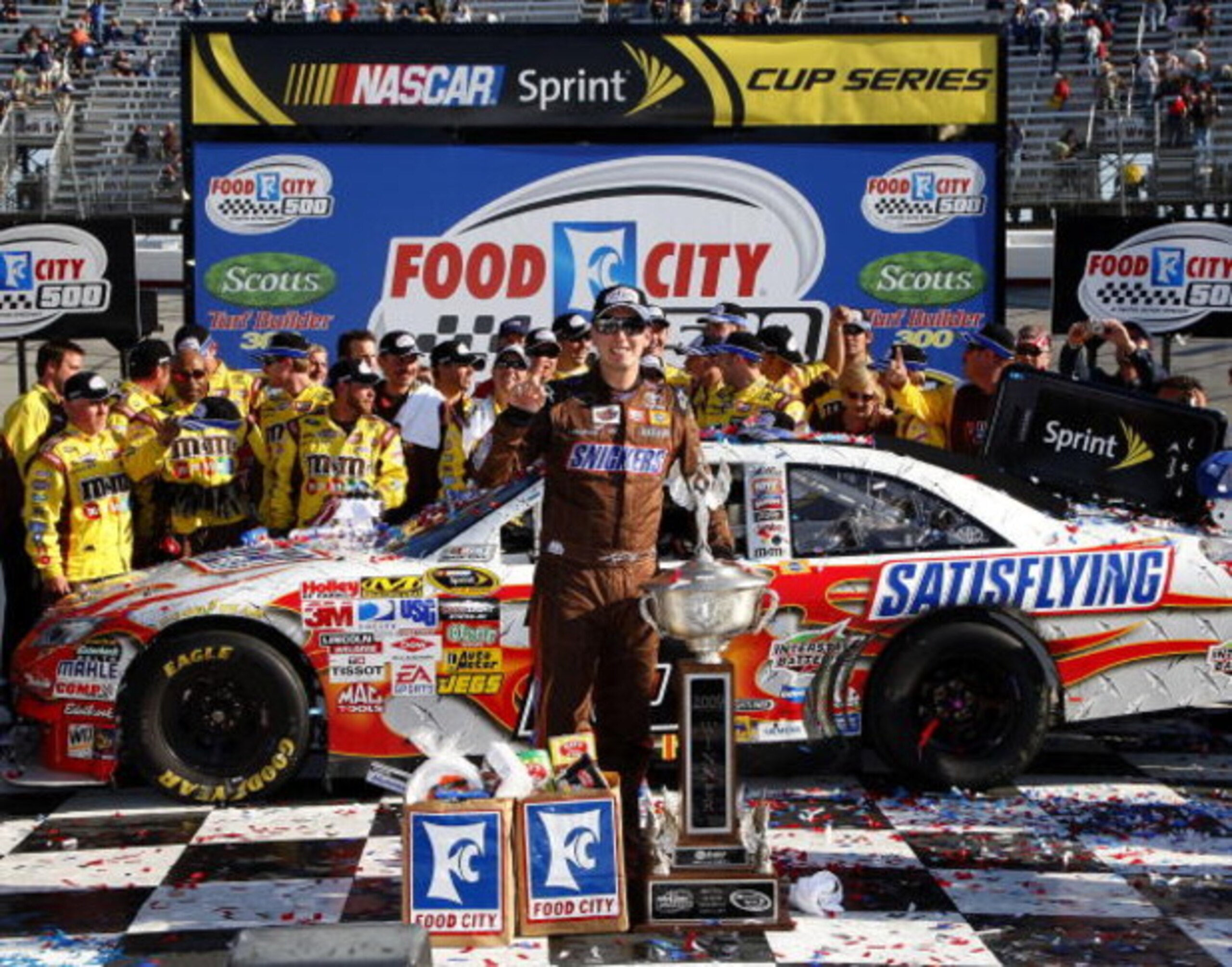 BRISTOL, TN - MARCH 22:  Kyle Busch, driver of the #18 Snickers Toyota, poses in victory lane after winning the NASCAR Sprint Cup Series Food City 500 at Bristol Motor Speedway on March 22, 2009 in Bristol, Tennessee.  (Photo by John Harrelson/Getty Image