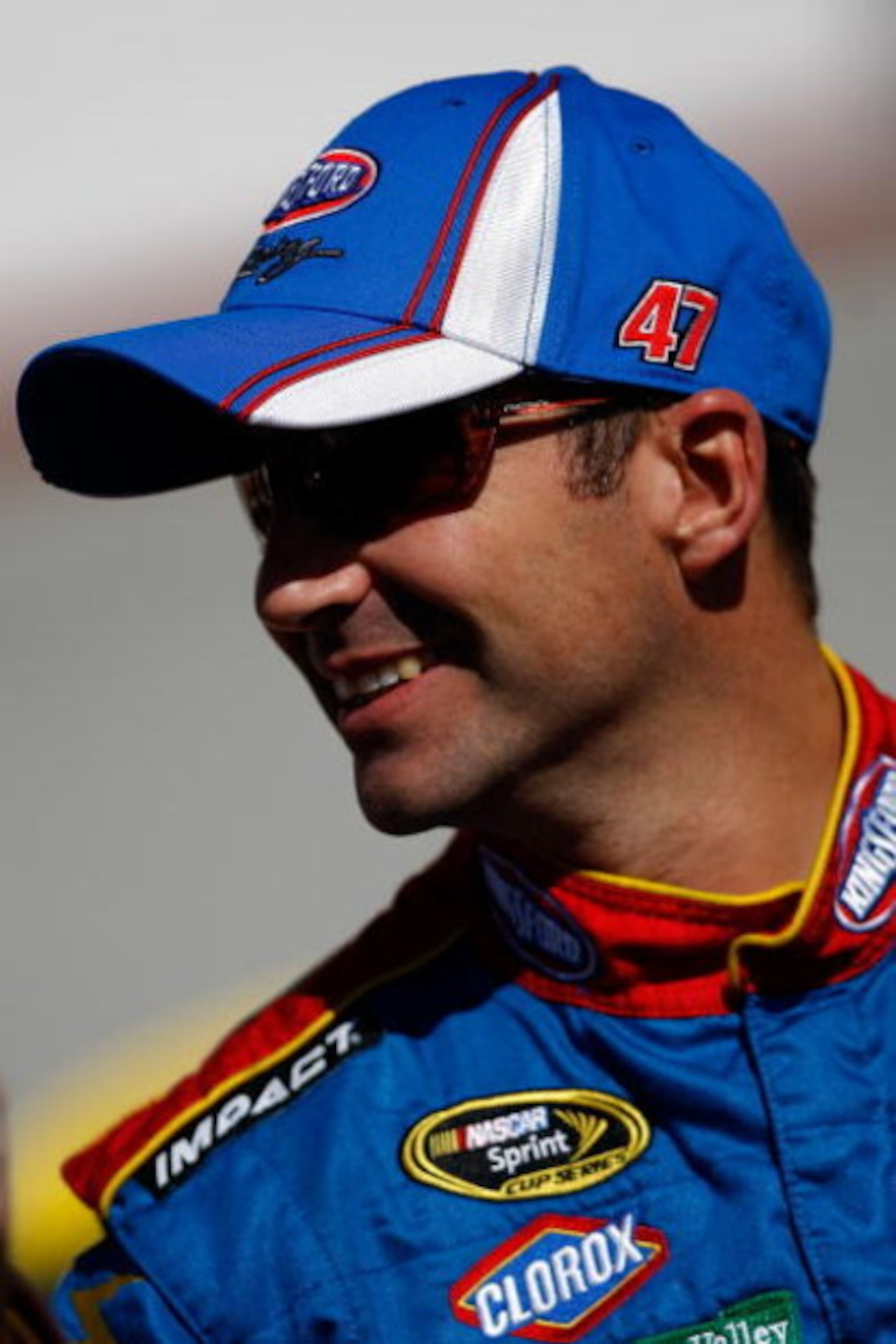 BRISTOL, TN - MARCH 20:  Marcos Ambrose, driver of the #47 Little Debbie/Cloroz/Kingsford Toyota  stands by his car during qualifying for the NASCAR Sprint Cup Series Food City 500 at Bristol Motor Speedway on March 20, 2009 in Bristol, Tennessee.  (Photo