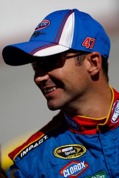 BRISTOL, TN - MARCH 20:  Marcos Ambrose, driver of the #47 Little Debbie/Cloroz/Kingsford Toyota  stands by his car during qualifying for the NASCAR Sprint Cup Series Food City 500 at Bristol Motor Speedway on March 20, 2009 in Bristol, Tennessee.  (Photo
