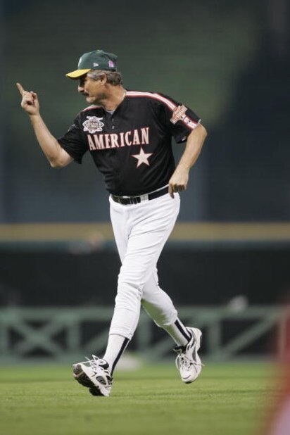HOUSTON - JULY 11:  Rollie Fingers, Hall of Fame pitcher who played with the Oakland A's and San Diego Padres gestures as he runs on the field during the Major League Baseball Legends and Celebrity Softball Game at Minute Maid Park on July 11, 2004 in Hou