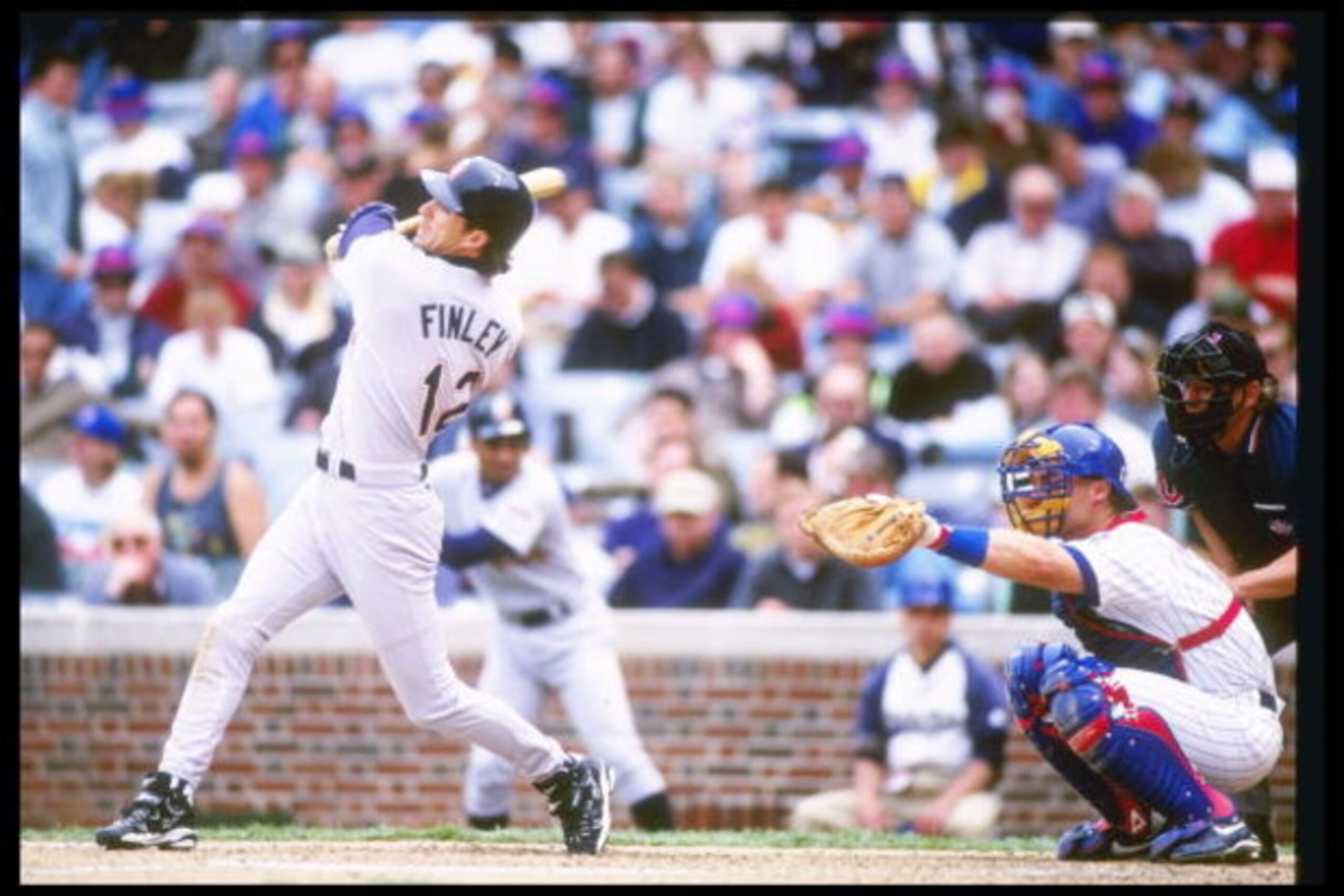 16 May 1997:  San Diego Padres center fielder Steve Finley swings at pitch during game against the Chicago Cubs at Wrigley Field in Chicago, Illinois.  The Cubs won the game 8-2. Mandatory Credit: Matthew Stockman  /Allsport
