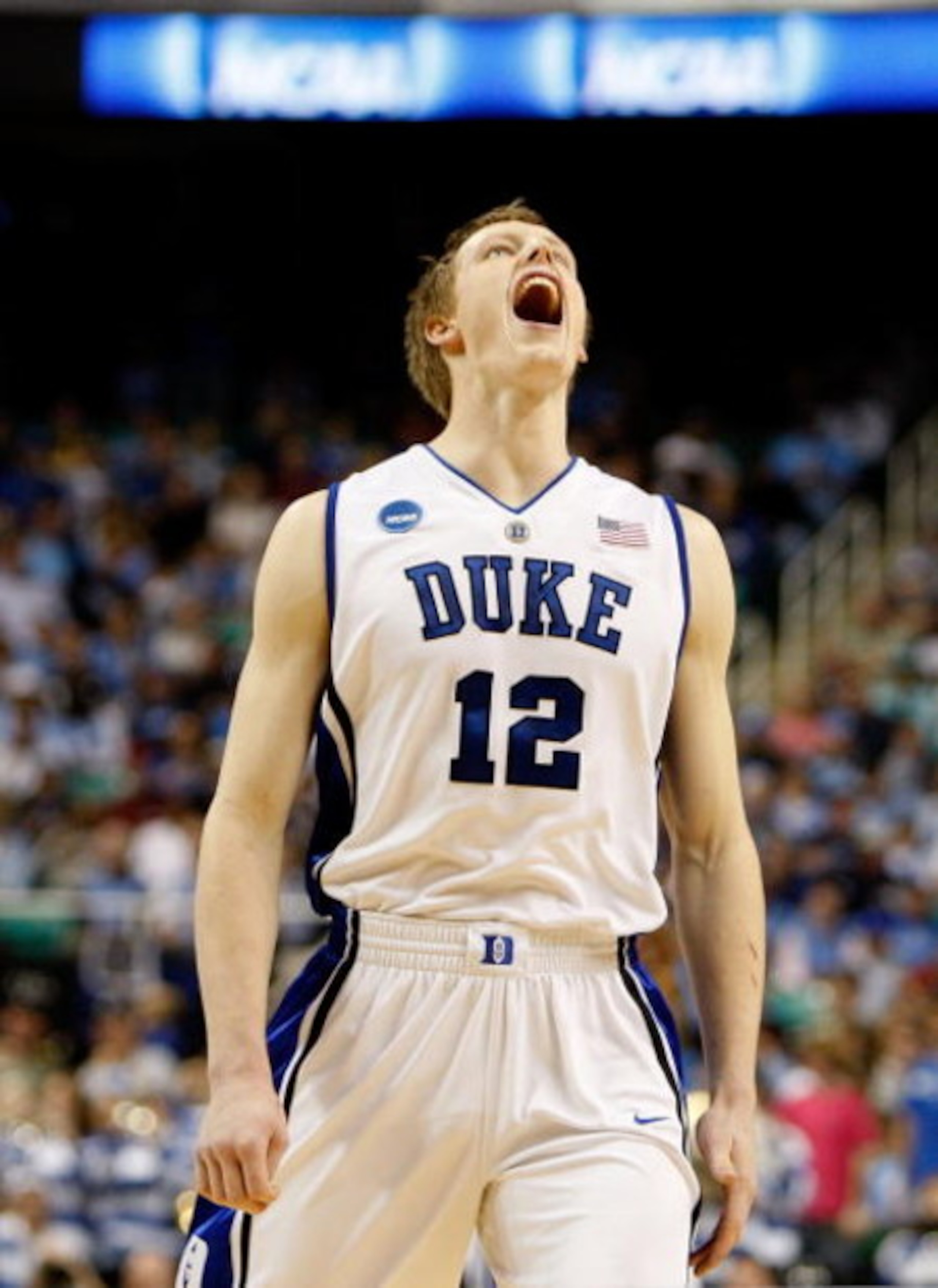 GREENSBORO, NC - MARCH 21:  Kyle Singler #12 of the Duke Blue Devils yells before facing the Texas Longhorns during the second round of the NCAA Division I Men's Basketball Tournament at the Greensboro Coliseum on March 21, 2009 in Greensboro, North Carol