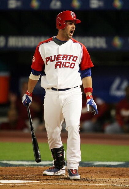 MIAMI - MARCH 16:  Ramon Vazquez #12 of Puerto Rico reacts to a called third strike in the first inning Venezuela during day 3 of round 2 of the World Baseball Classic at Dolphin Stadium on March 16, 2009 in Miami, Florida.  (Photo by Doug Benc/Getty Imag