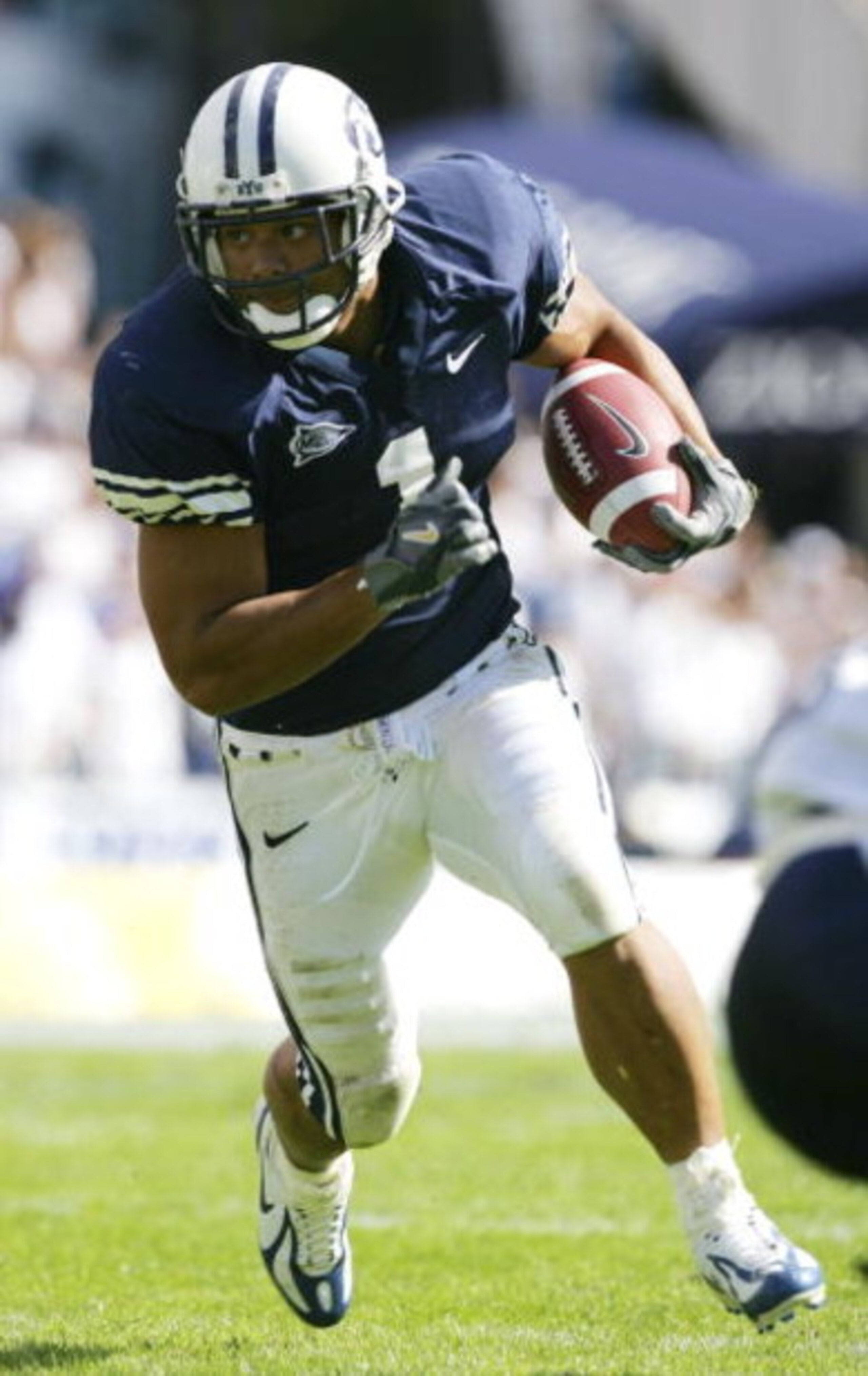 PROVO, UT - SEPTEMBER 23:   Fui Vakapuna #1 of BYU runs with the ball against Utah State September 23, 2006 in Provo, Utah. BYU defeated Utah State 38-0.  (Photo by Kent Horner/Getty Images)    