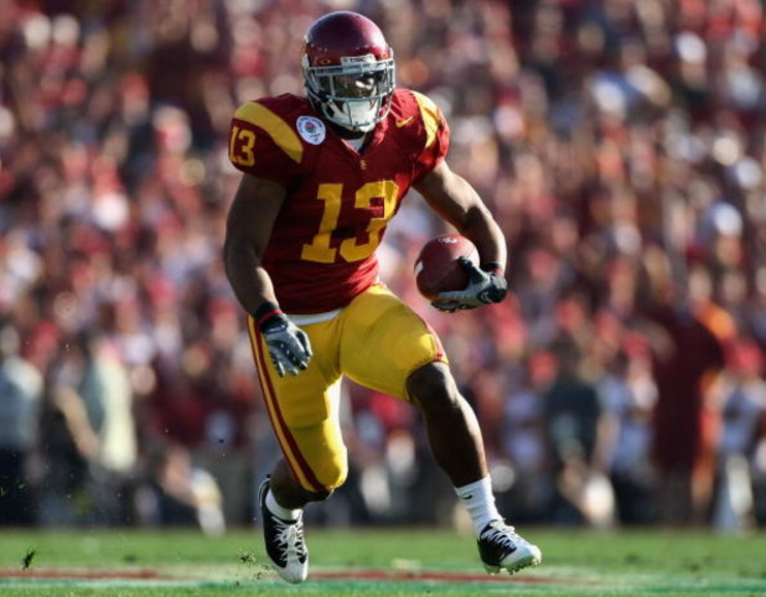 PASADENA, CA - JANUARY 01:  Stafon Johnson #13 of the USC Trojans rushes the ball during the 95th Rose Bowl Game presented by Citi against the Penn State Nittany Lions at the Rose Bowl on January 1, 2009 in Pasadena, California. The Trojans defeated the N