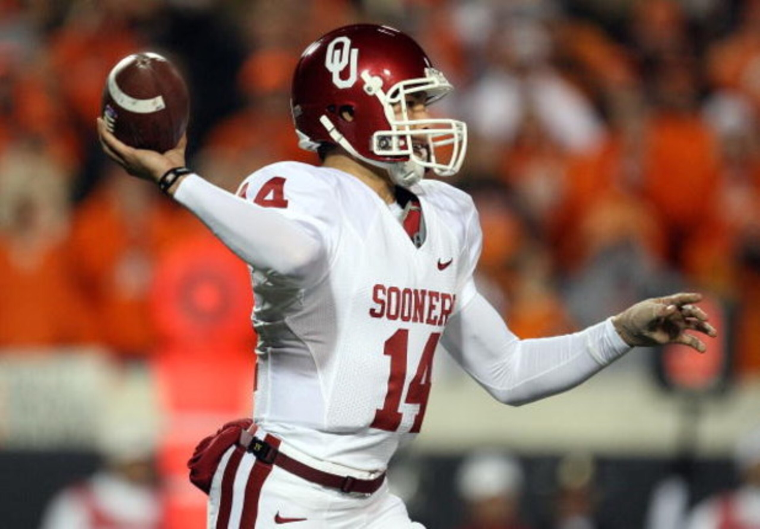 STILLWATER, OK - NOVEMBER 29:  Quarterback Sam Bradford #14 of the Oklahoma Sooners drops back to pass against the Oklahoma State Cowboys at Boone Pickens Stadium on November 29, 2008 in Stillwater, Oklahoma.  (Photo by Ronald Martinez/Getty Images)
