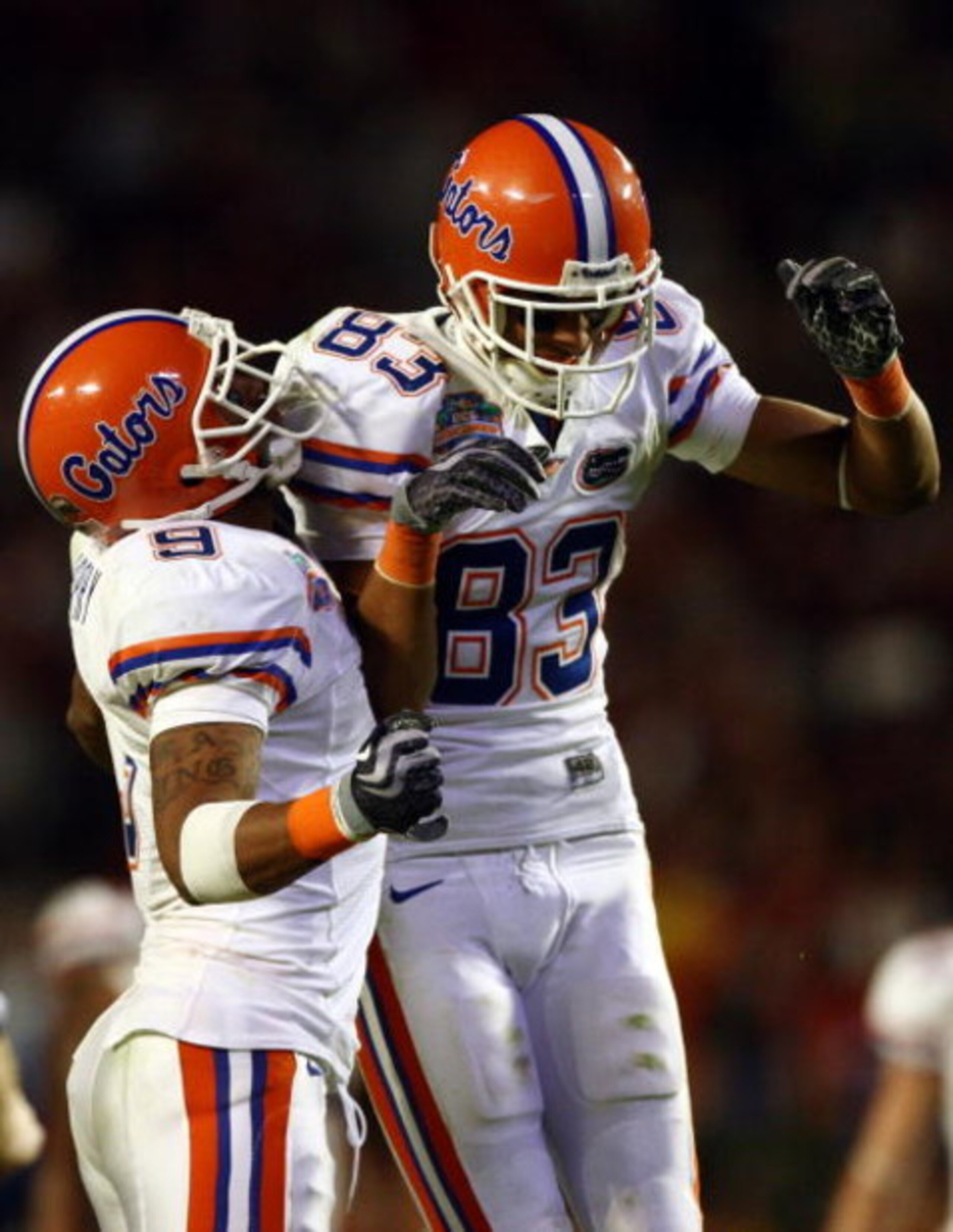 MIAMI - JANUARY 08:  David Nelson #83 and Louis Murphy #9 of the Florida Gators celebrate after a play against the Oklahoma Sooners in the FedEx BCS National Championship Game at Dolphin Stadium on January 8, 2009 in Miami, Florida.  (Photo by Donald Mira
