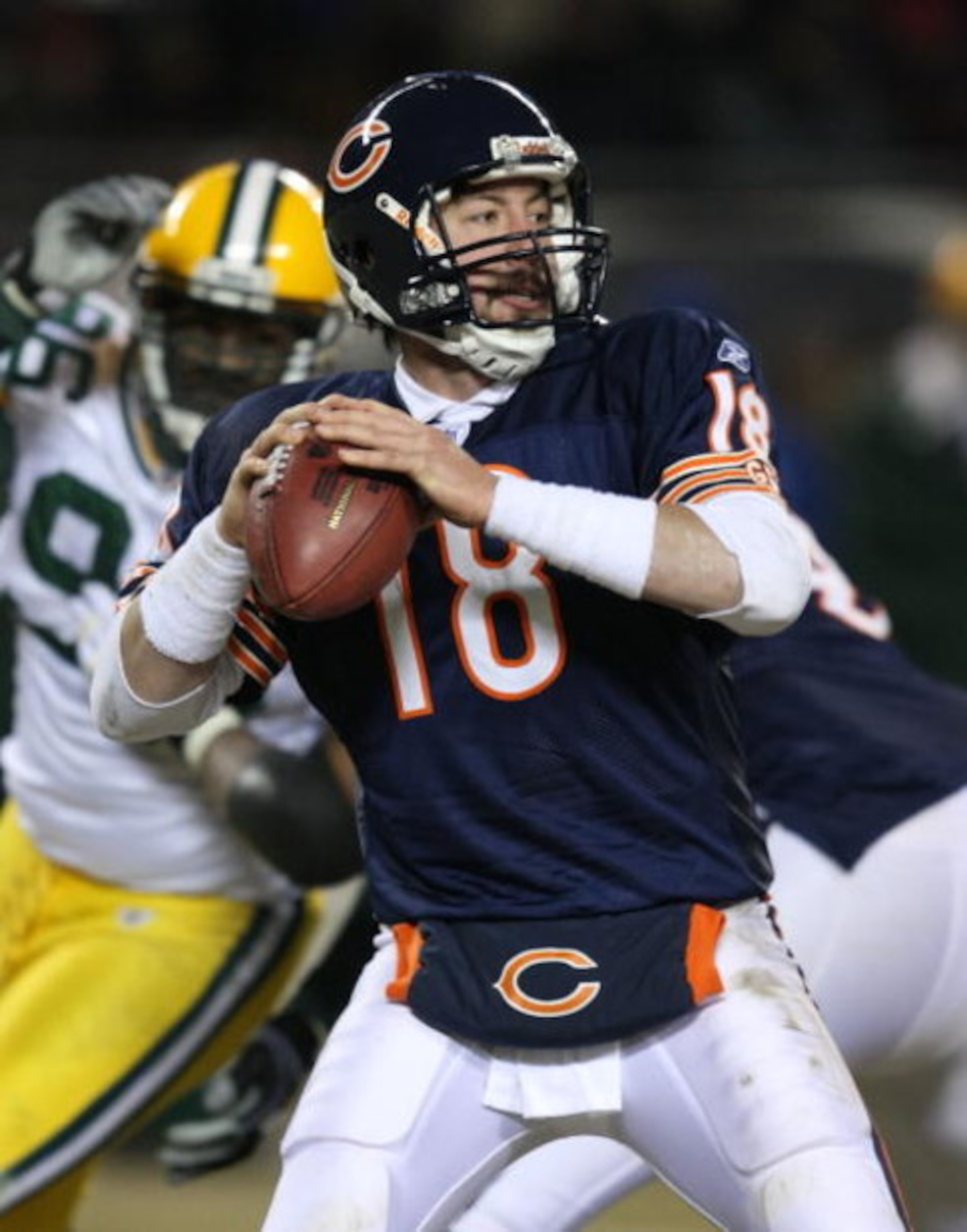 CHICAGO - DECEMBER 22: Kyle Orton #18 of the Chicago Bears looks for a receiver against the Green Bay Packers on December 22, 2008 at Soldier Field in Chicago, Illinois. The Bears defeated the Packers 20-17 in overtime. (Photo by Jonathan Daniel/Getty Ima