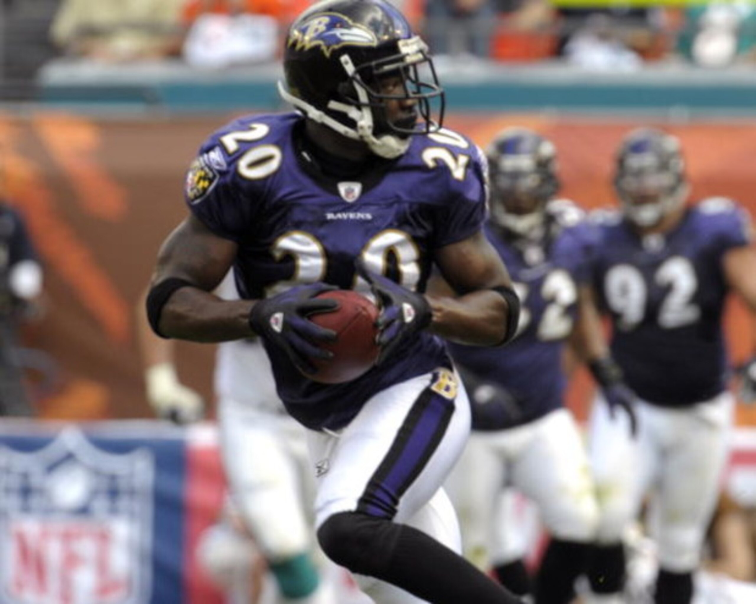 MIAMI, FL - JANUARY 4:  Safety Ed Reed #20 of the Baltimore Ravens intercepts a pass against the Miami Dolphins in an NFL Wildcard Playoff Game at Dolphins Stadium on January 4, 2009 in Miami, Floirda.  Reed ran for a touchdown with the interception. (Pho