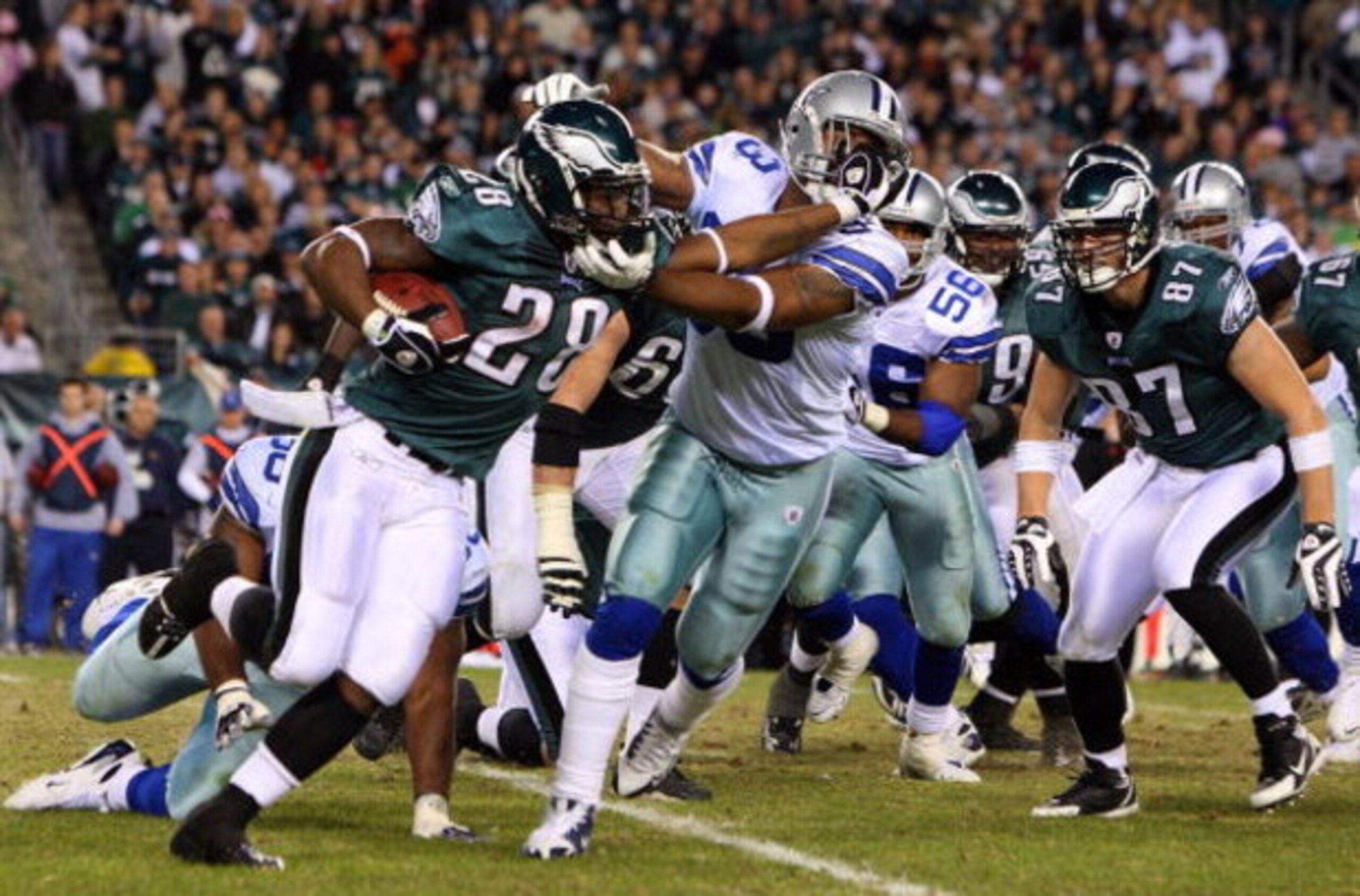 PHILADELPHIA - DECEMBER 28:  Correll Buckhalter #28 of the Philadelphia Eagles runs the ball against Anthony Spencer #93 of the Dallas Cowboys on December 28, 2008 at Lincoln Financial Field in Philadelphia, Pennsylvania. The Eagles defeated the Cowboys 4