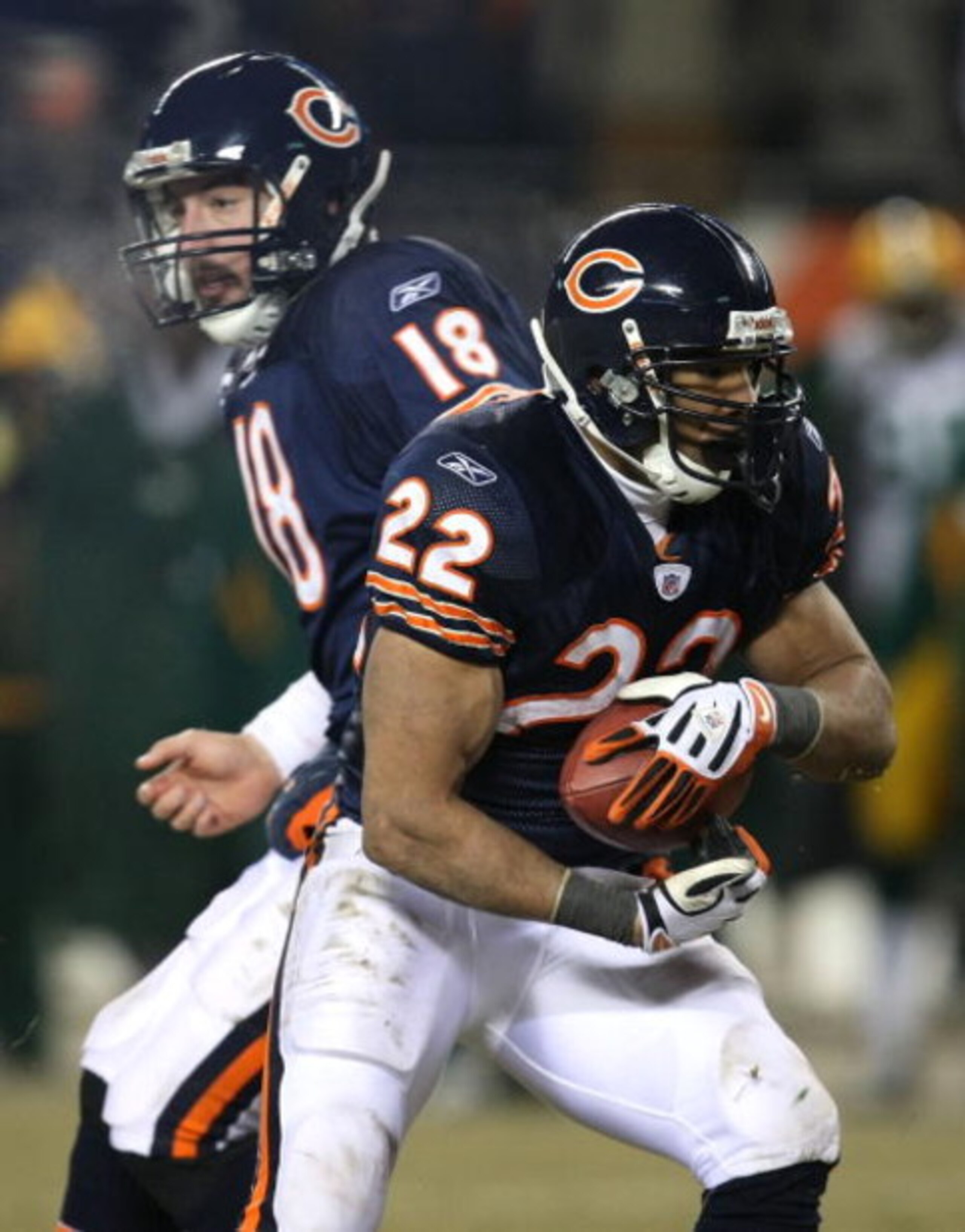 CHICAGO - DECEMBER 22: Matt Forte #22 of the Chicago Bears takes the hand-off from Kyle Orton #18 against the Green Bay Packers on December 22, 2008 at Soldier Field in Chicago, Illinois. The Bears defeated the Packers 20-17 in overtime. (Photo by Jonatha