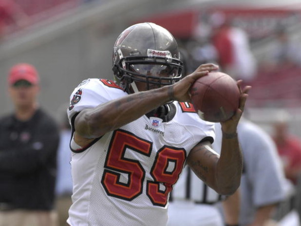 TAMPA, FL - OCTOBER 28: Linebacker Cato June #59 of the Tampa Bay Buccaneers warms up for play against the Jacksonville Jaguars at Raymond James Stadium on October 28, 2007 in Tampa, Florida. The Jaguars won 24 - 23. (Photo by Al Messerschmidt/Getty Ima TAMPA, FL - OCTOBER 28: Linebacker Cato June #59 of the Tampa Bay Buccaneers warms up for play against the Jacksonville Jaguars at Raymond James Stadium on October 28, 2007 in Tampa, Florida. The Jaguars won 24 - 23. (Photo by Al Messerschmidt/Getty Ima