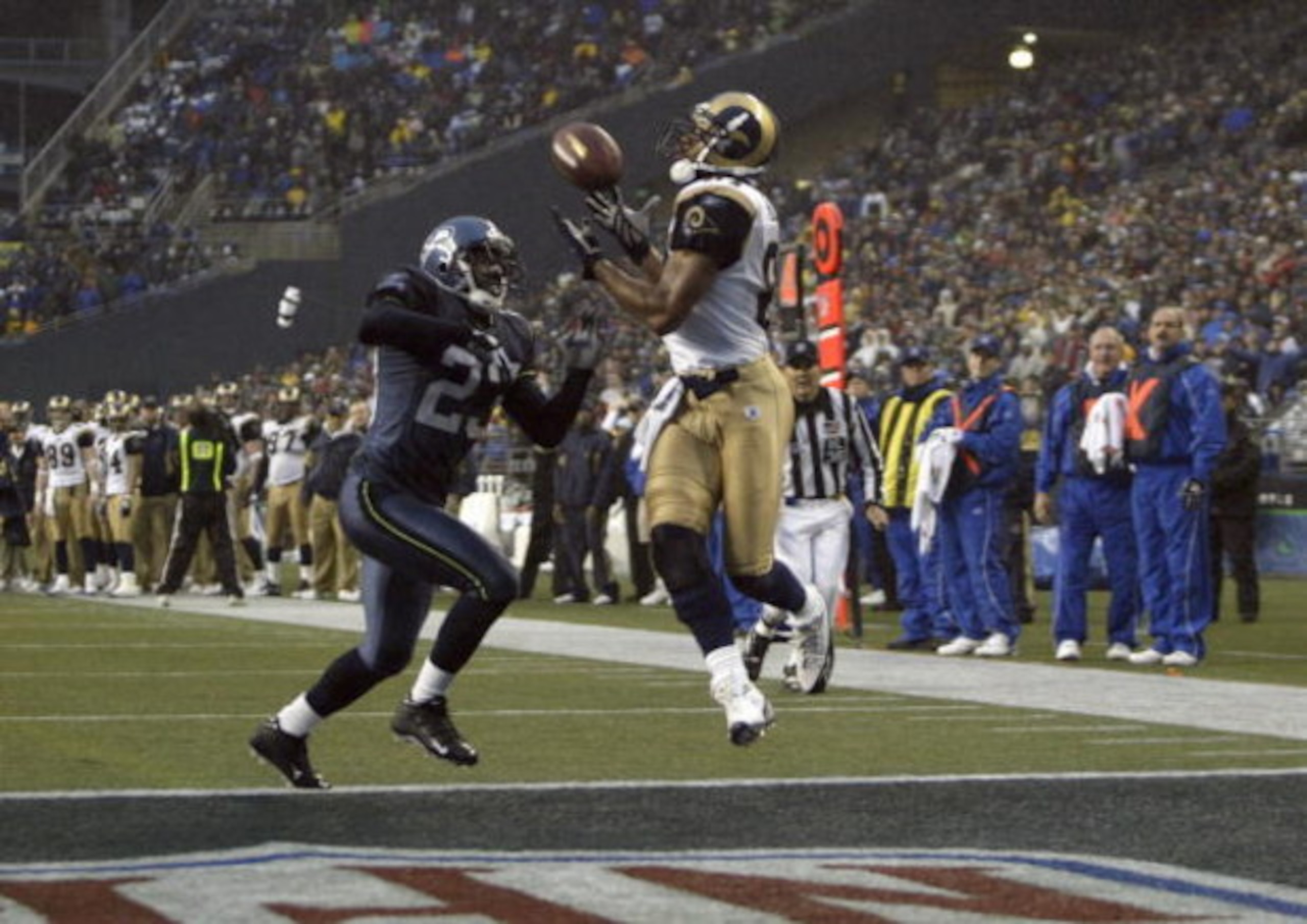 SEATTLE - NOVEMBER 13:  Marcus Trufant #23 of the Seattle Seahawks can't stop a touchdown pass to Torry Holt #81 of the St. Louis Rams during the game at Qwest Field on November 13, 2005 in Seattle, Washington.  The Seahawks won 31-16. (Photo by Otto Greu