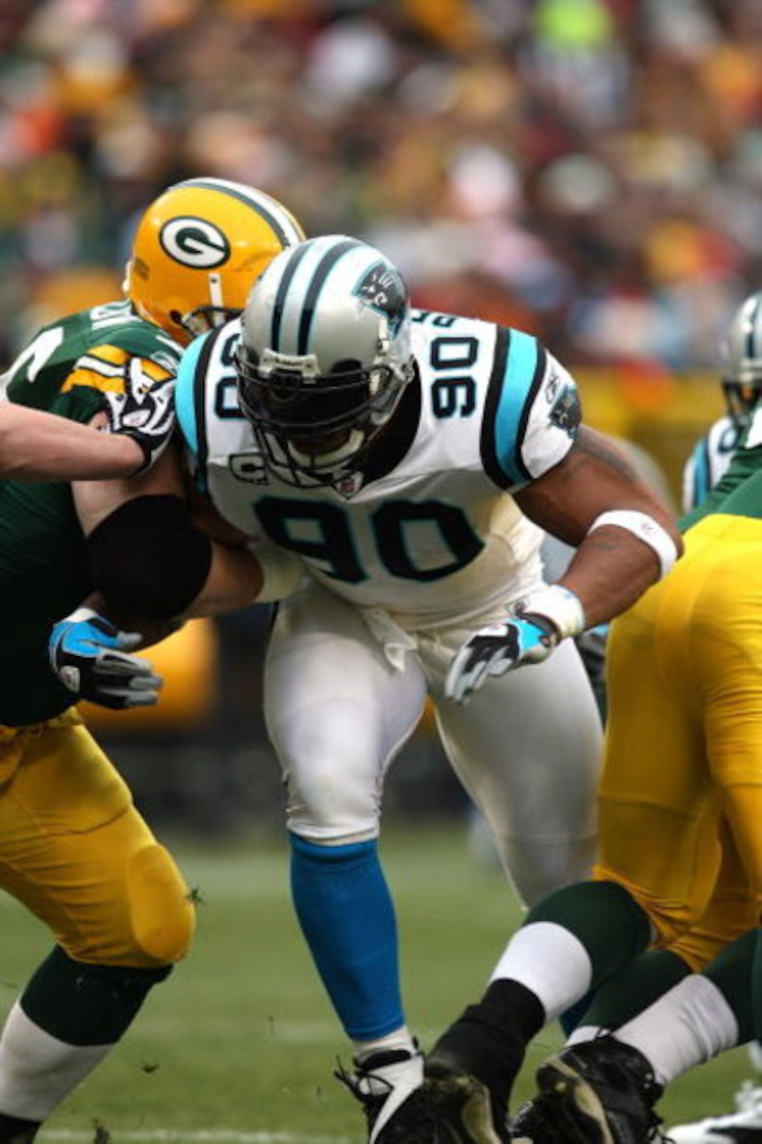 GREEN BAY, WI - NOVEMBER 30:  Julius Peppers #90 of the Carolina Panthers rushes the passer against the Green Bay Packers at Lambeau Field on November 30, 2008 in Green Bay, Wisconsin. The Panthers won 35-31.  (Photo by Jonathan Daniel/Getty Images)