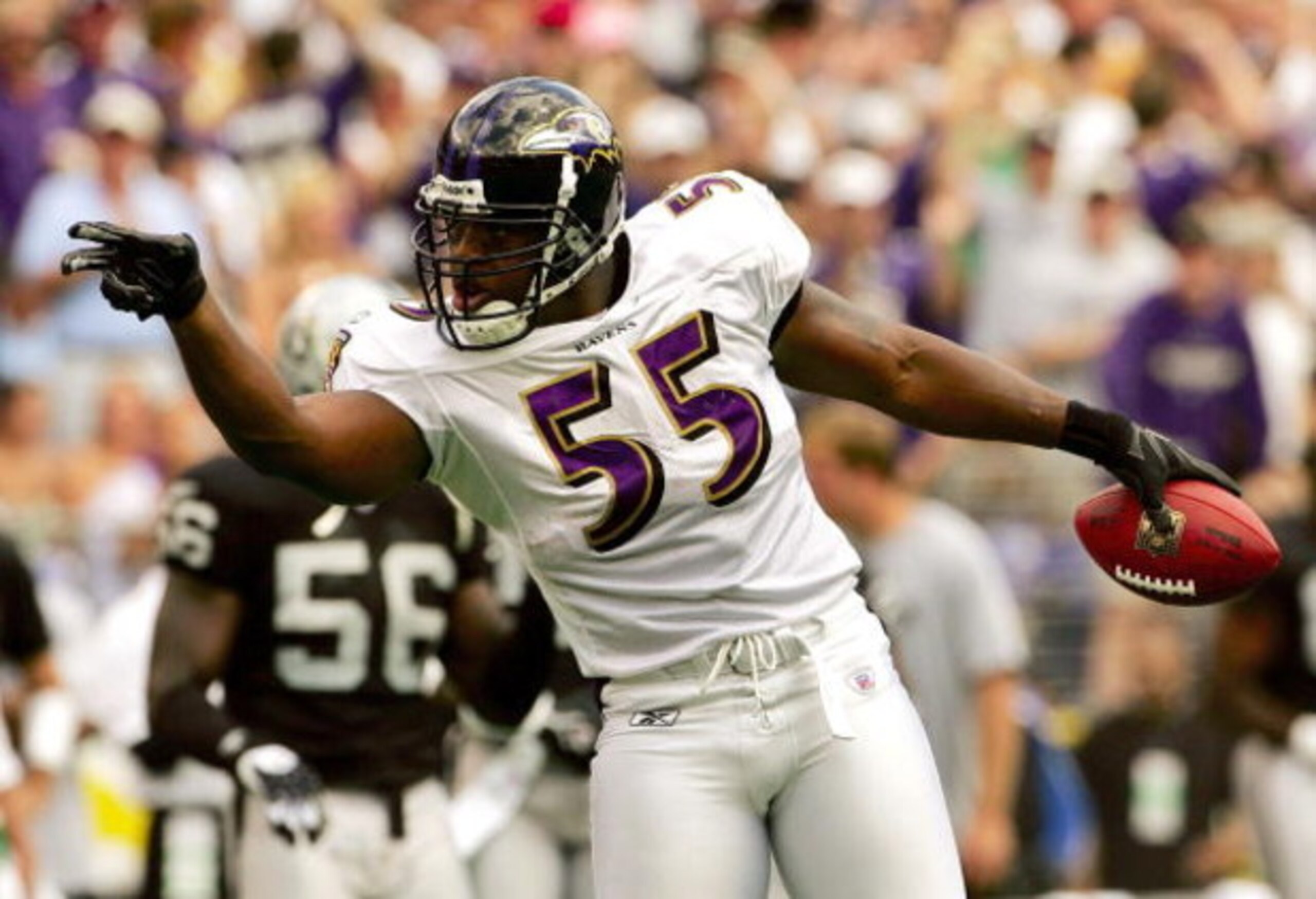 BALTIMORE - SEPTEMBER 17:  Linebacker Terrell Suggs #55 of the Baltimore Ravens gestures to the crowd after recovering a fumble in first quarter against the Oakland Raiders on September 17, 2006 at M&T Bank Stadium in Baltimore, Maryland.  (Photo by Win M