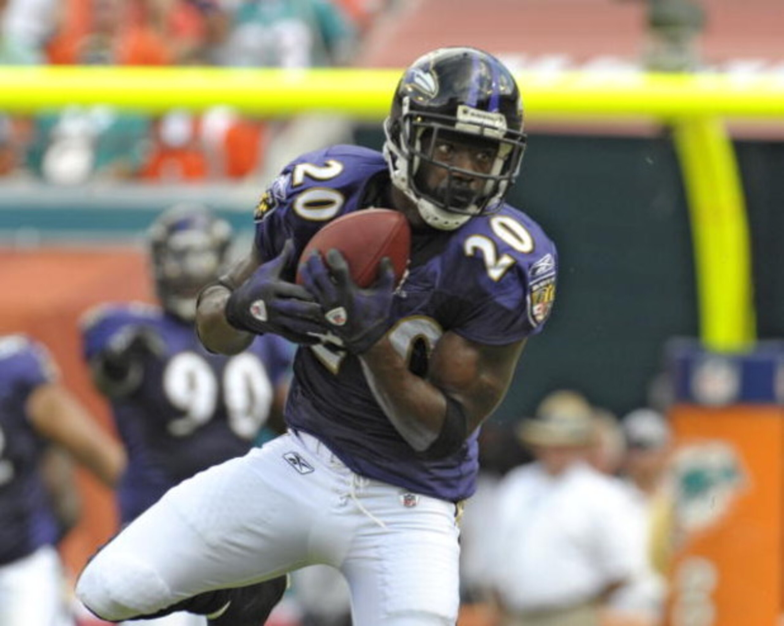 MIAMI, FL - JANUARY 4:  Safety Ed Reed #20 of the Baltimore Ravens intercepts a pass against the Miami Dolphins in an AFC wild card game at Dolphins Stadium January 4, 2009 in Miami, Floirda.  Reed ran the interception back for a touchdown. (Photo by Al M