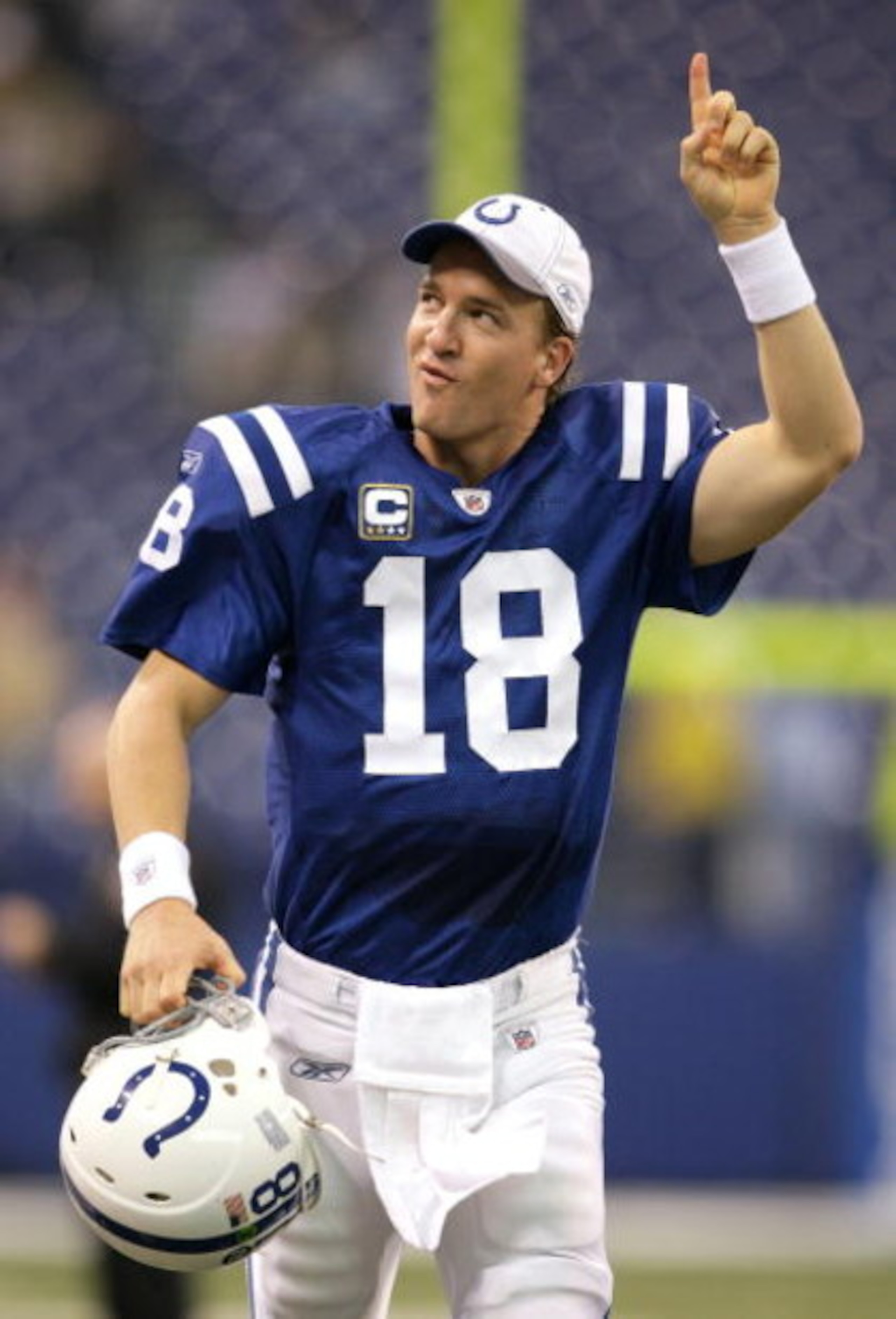 INDIANAPOLIS - DECEMBER 07:  Peyton Manning #18 of the Indianapolis Colts celebrates as he runs off the field after their 35-3 win against the Cincinnati Bengals at Lucas Oil Stadium on December 7, 2008 in Indianapolis, Indiana.  (Photo by Andy Lyons/Gett