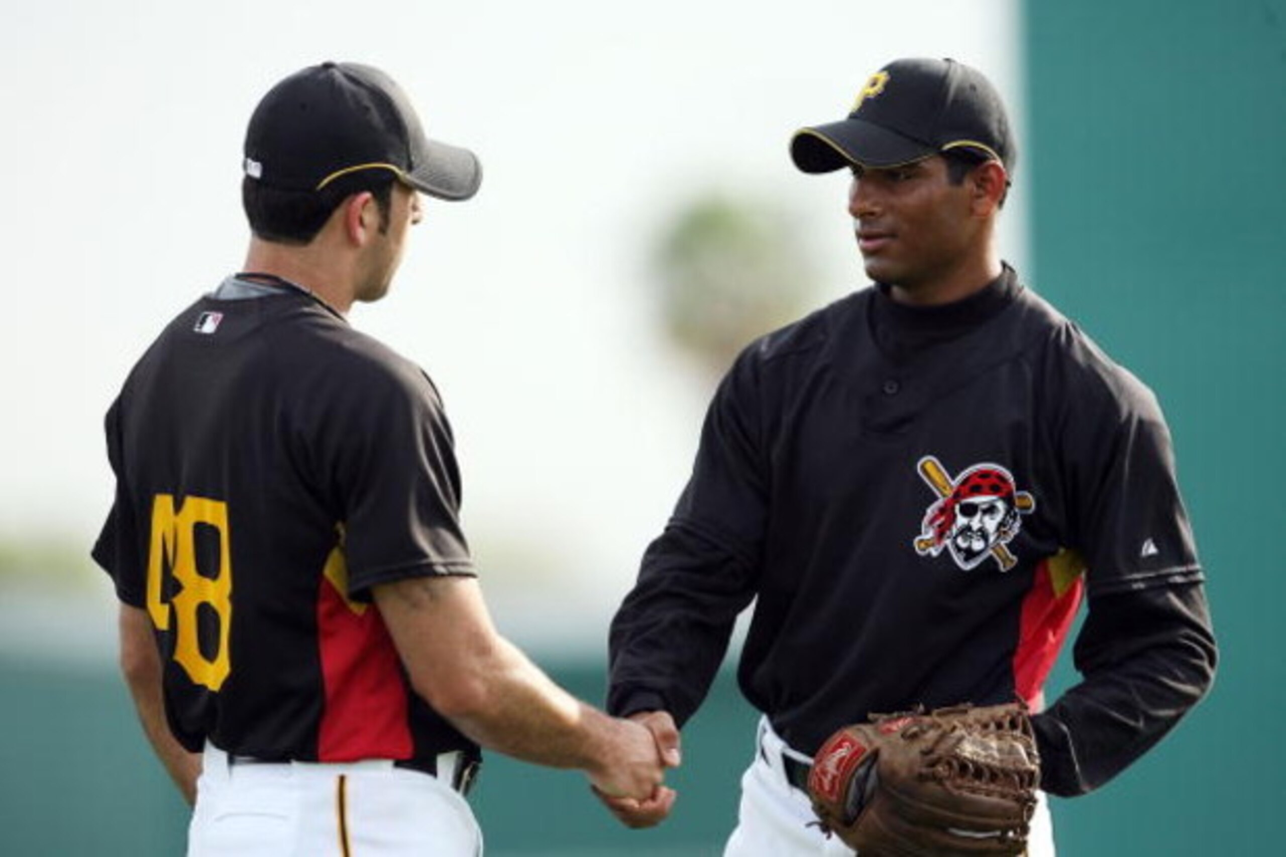 BRADENTON, FL - MARCH 27:  Rinku Singh (R) of the Pittsburgh Pirates thanks a teammate after getting some advice during practice at the Pirates minor league training facility on March 27, 2009 in Bradenton, Florida.  (Photo by Doug Benc/Getty Images)