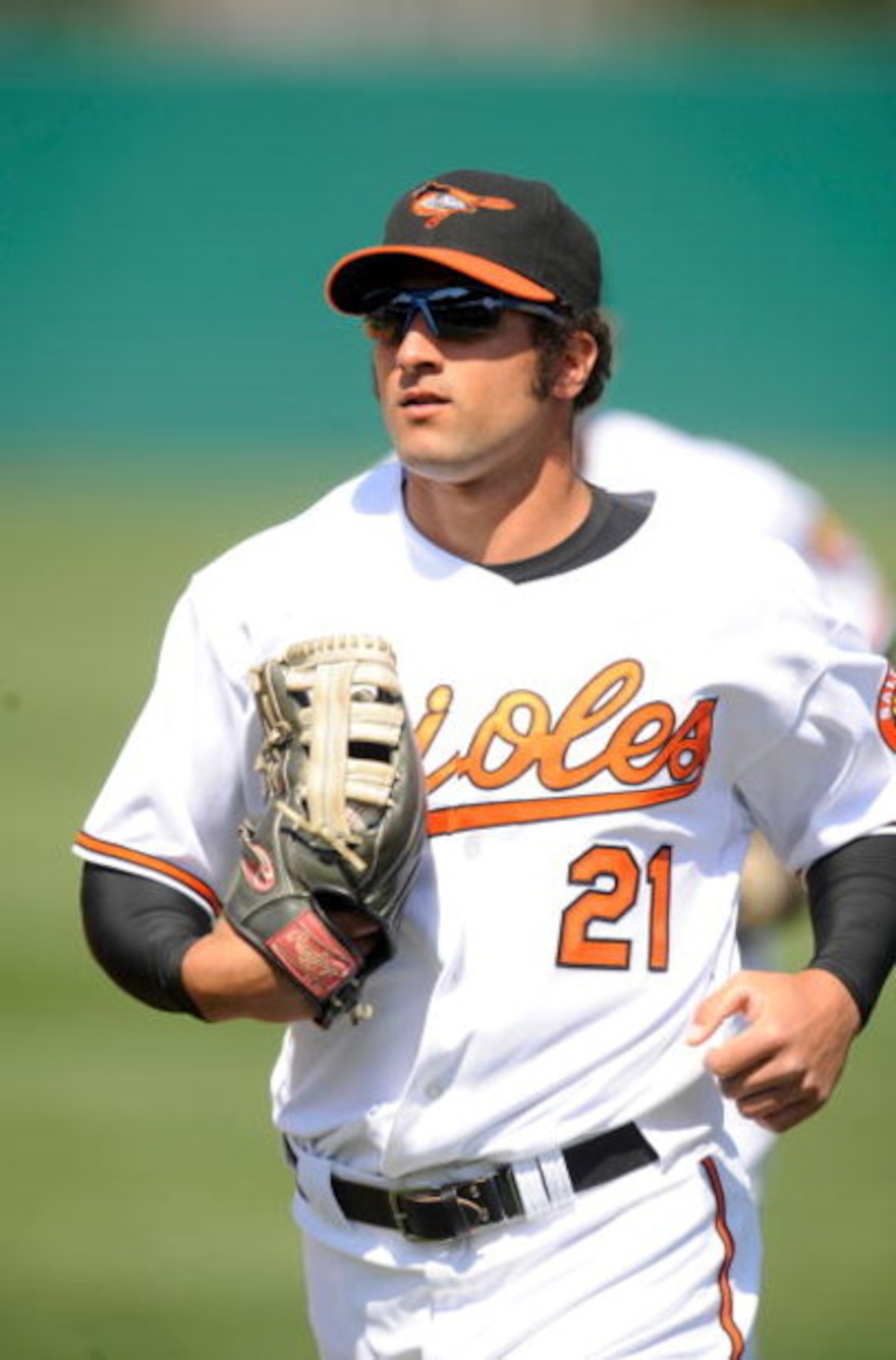 FORT LAUDERDALE, FL - MARCH 2: Nick Markakis #21 of the Baltimore Orioles runs in from the outfield against the Boston Red Sox during a spring training game at Fort Lauderdale Stadium on March 2, 2009 in Fort Lauderdale, Florida. (Photo by Rob Tringali/Ge