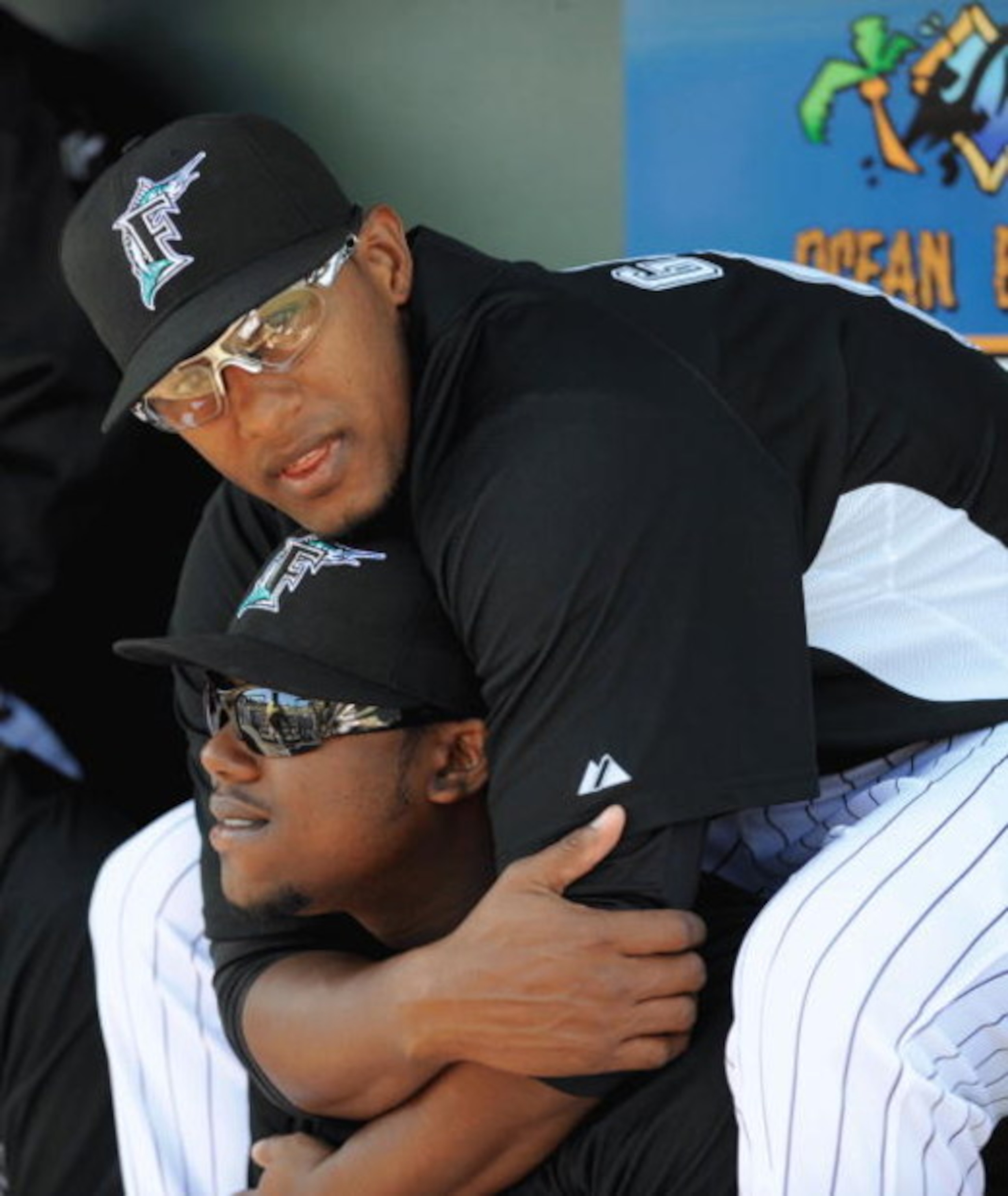 JUPITER, FL - FEBRUARY 27: Hanley Ramirez #2 of the Florida Marlins gets a hug from Andy Gonzalez #50 before a game against the Baltimore Orioles during a spring training game at Roger Dean Stadium on February 27, 2009 in Jupiter, Florida. (Photo by Rob T