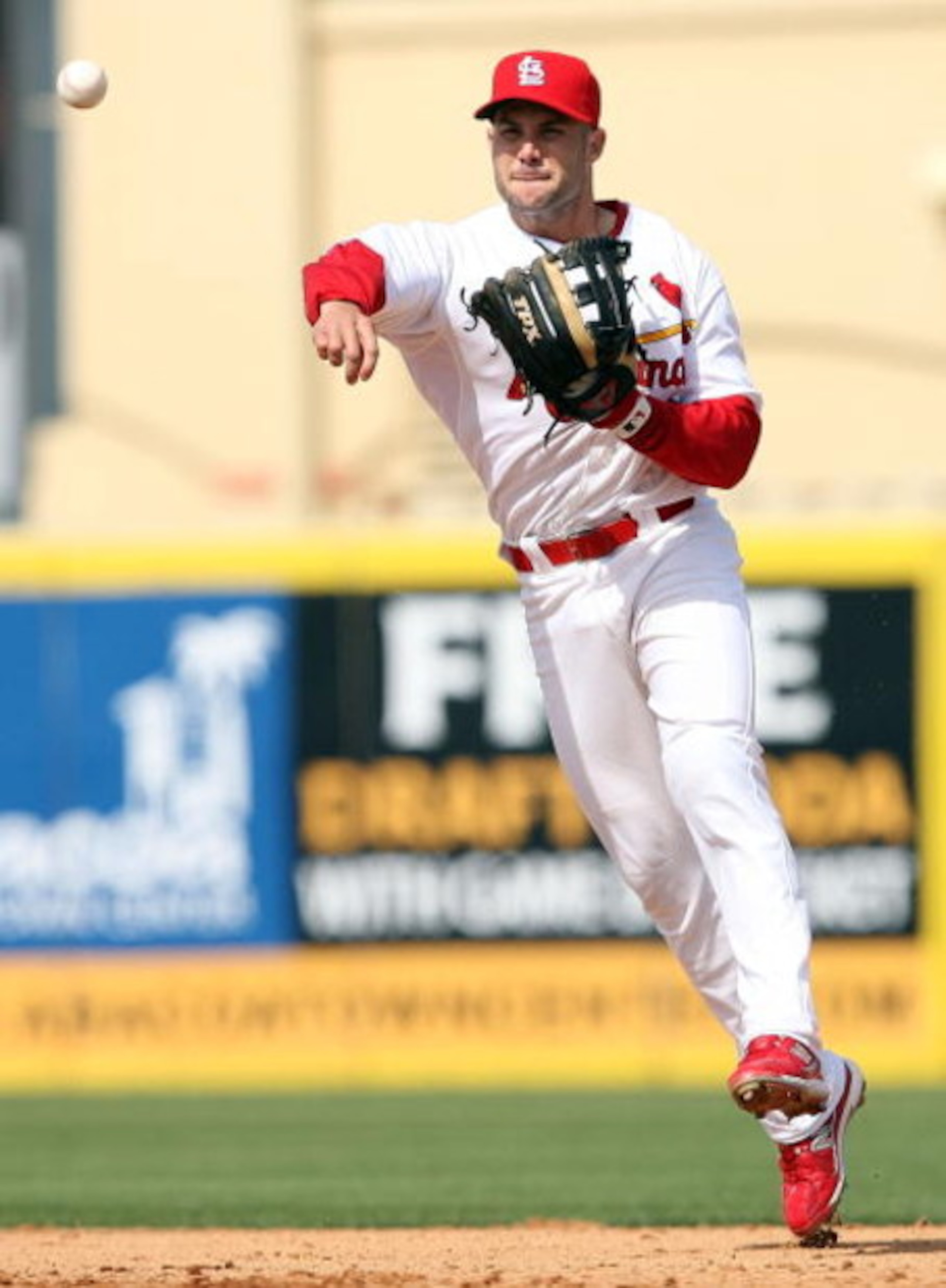JUPITER, FL - MARCH 02:  Second baseman Skip Schumaker #55 of the St. Louis Cardinals tries to throw out Evan Longoria #3 of the Tampa Bay Rays during a spring training game at Roger Dean Stadium on March 2, 2009 in Jupiter, Florida. The Rays defeated the